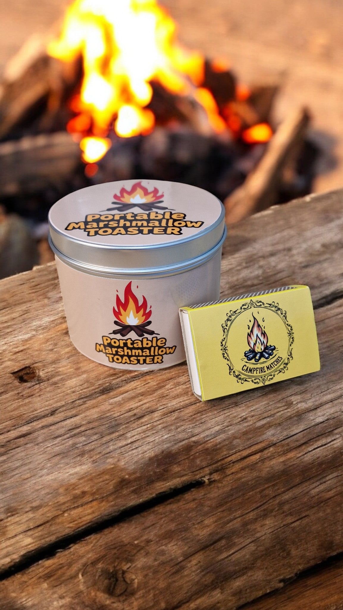 Portable marshmallow toaster with matches on a wooden surface in front of a fire.