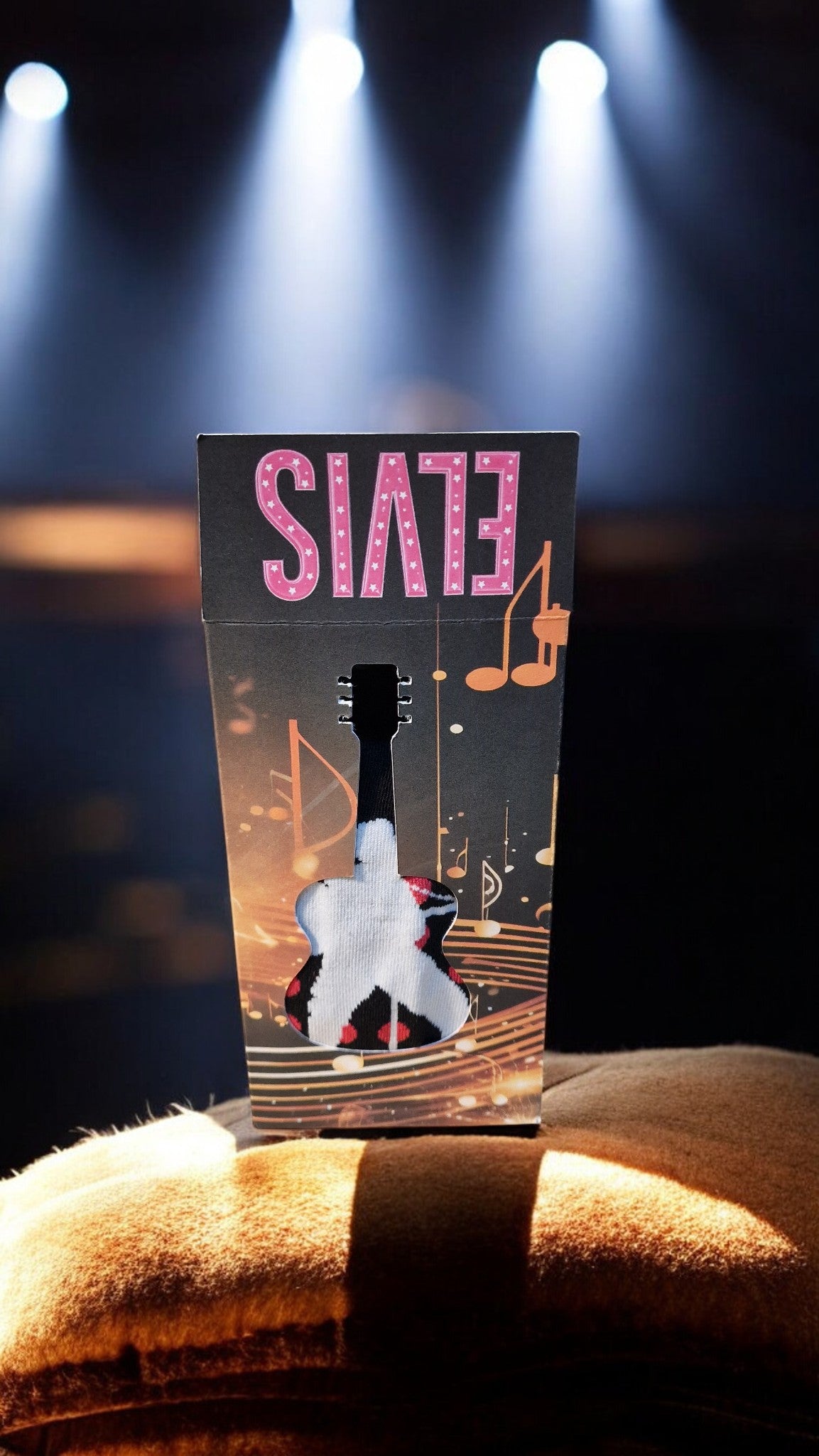 Product packaging with 'EYES' branding on a dark background with stage lights.