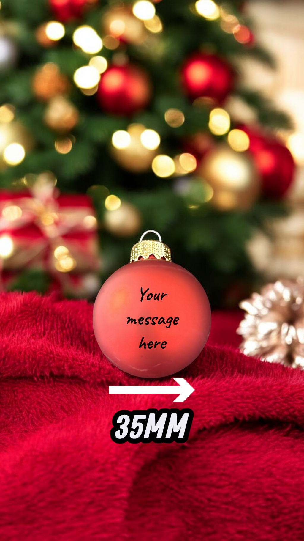 Red Christmas ornament with a blurred Christmas tree and presents in the background