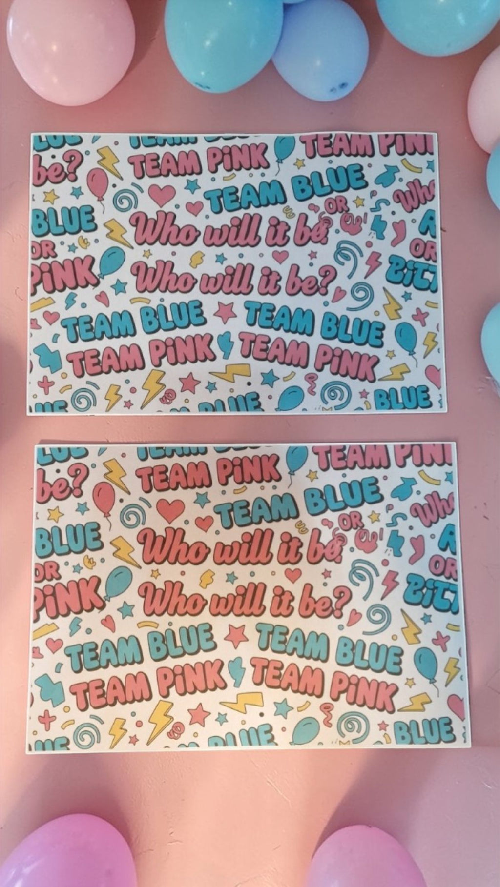 Two sheets of paper with 'Team Pink' and 'Team Blue' text and graphics on a pink background with balloons.