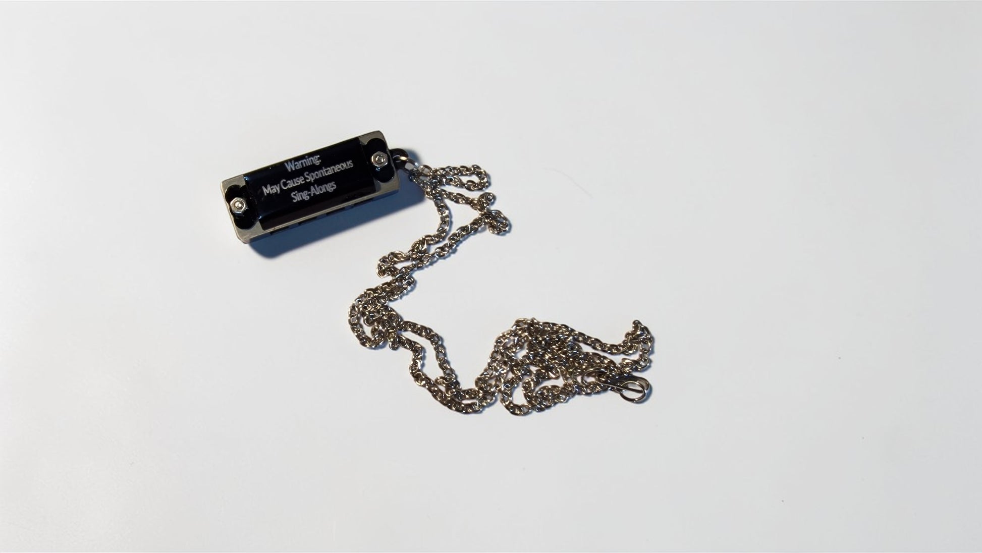 Metallic chain necklace on a white background