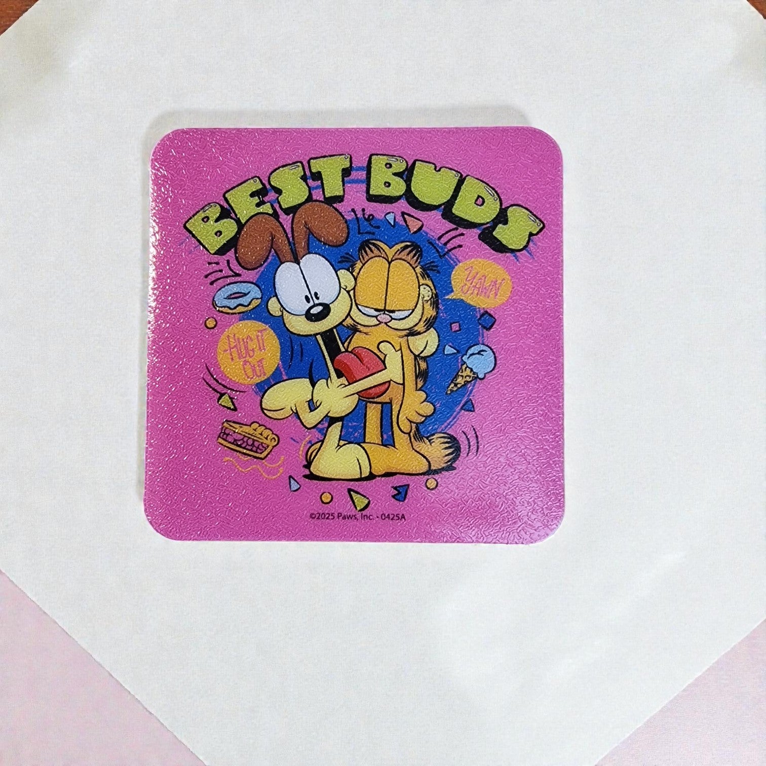 Coaster with cartoon characters and 'Best Buds' text on a pink background