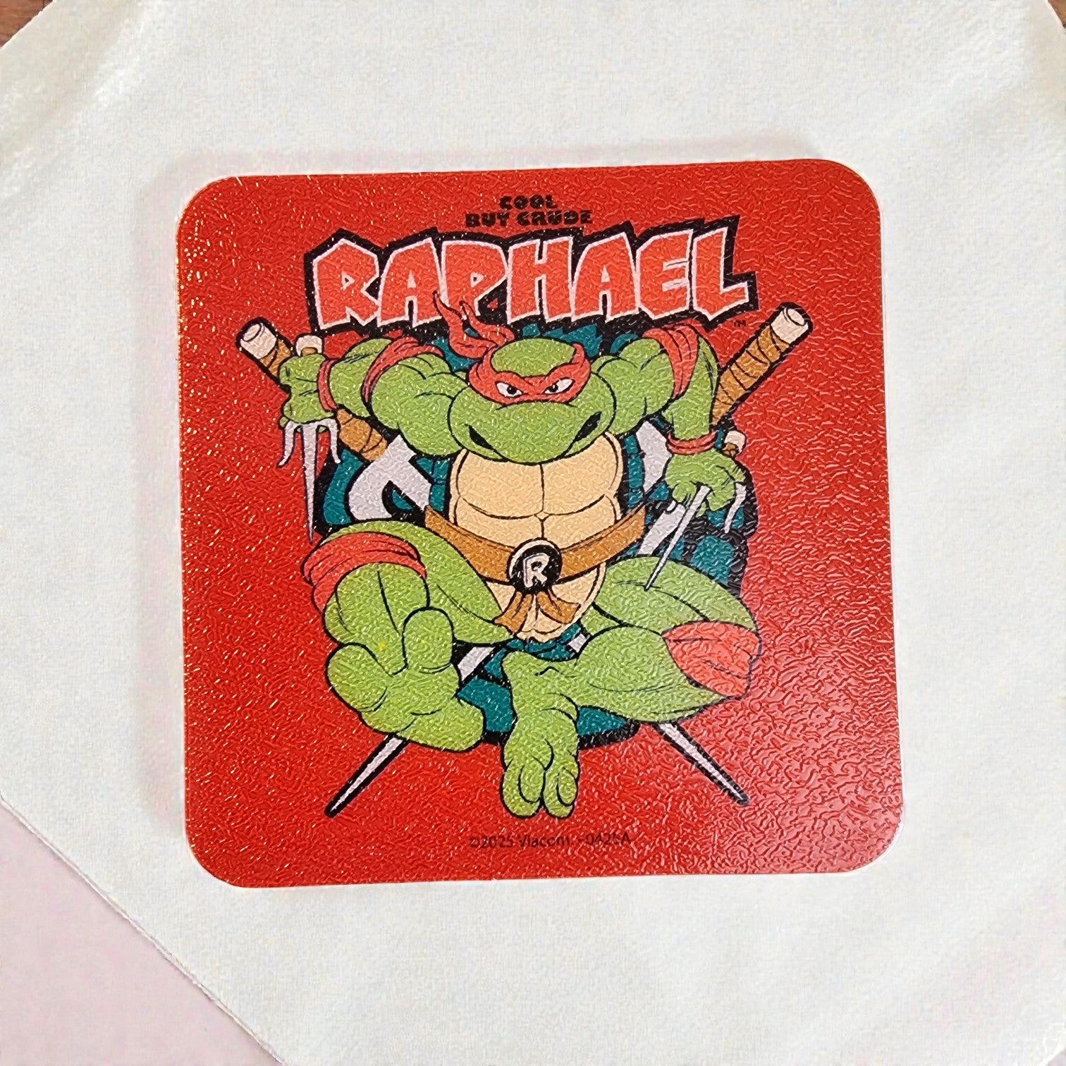 Coaster with Raphael from Teenage Mutant Ninja Turtles on a red background