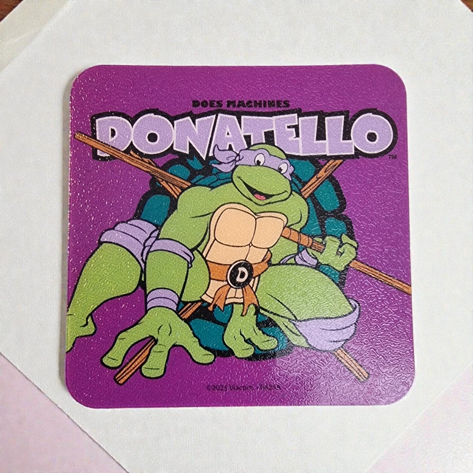 Coaster with Donatello from Teenage Mutant Ninja Turtles on a purple background
