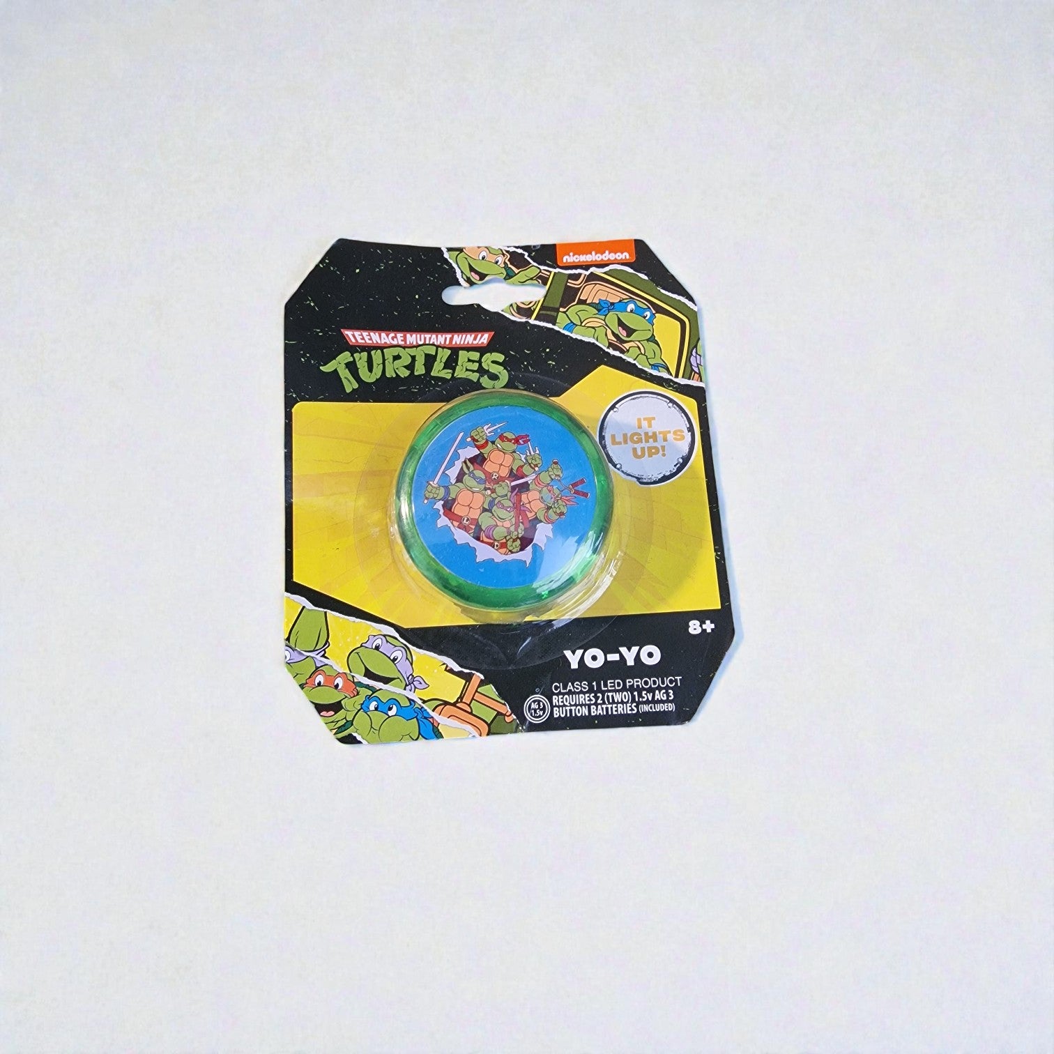 Yoyo with LED light-up feature on a Teenage Mutant Ninja Turtles packaging