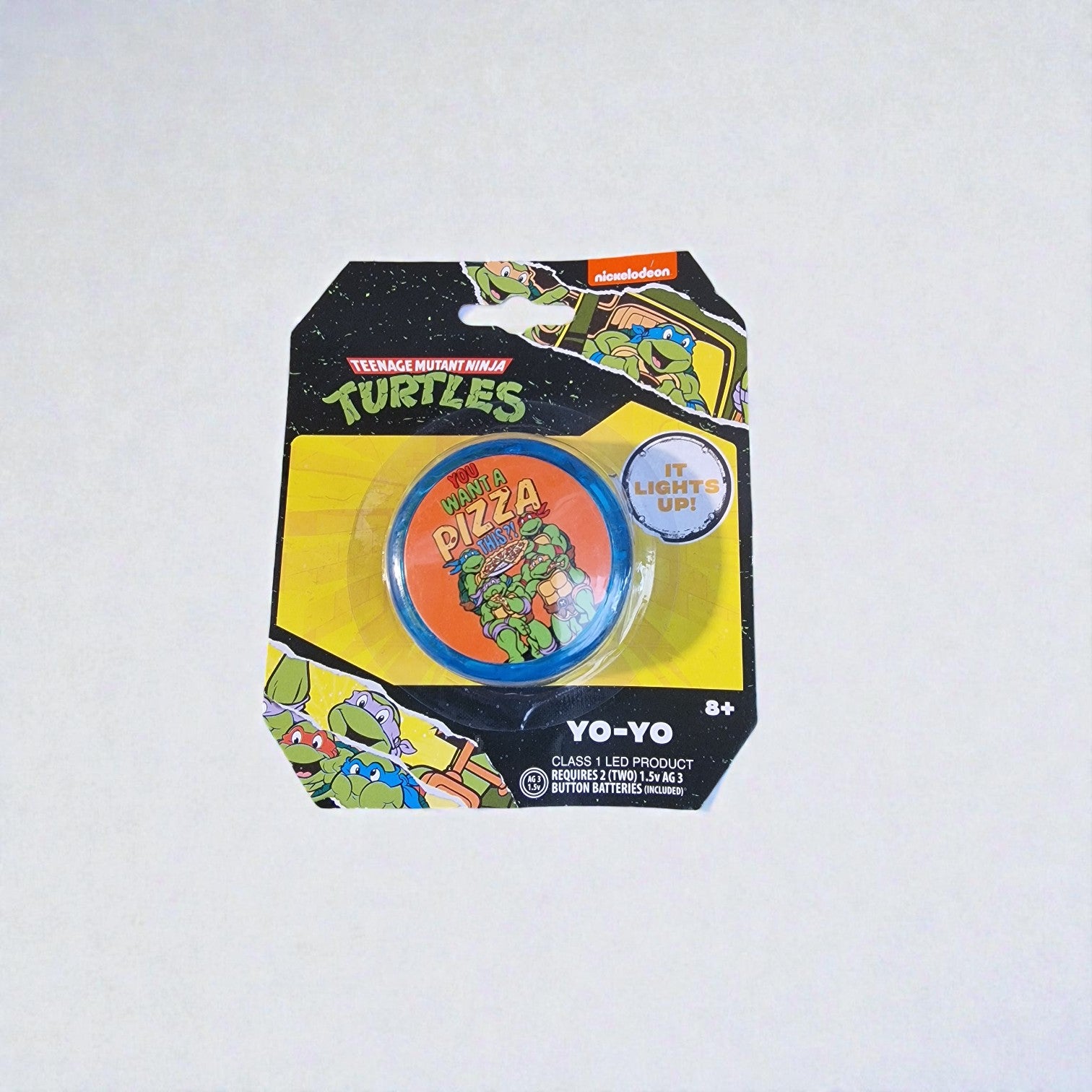 Yo-yo with Teenage Mutant Ninja Turtles branding on a white background