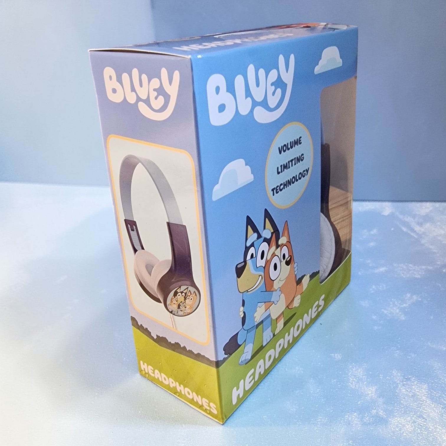 Box of Bluey headphones with cartoon characters on a light blue background