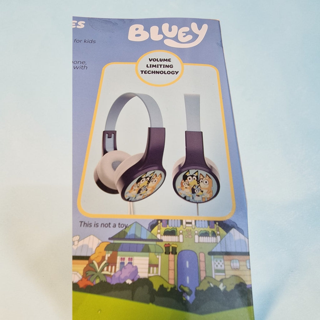 Packaged headphones with 'Bluey' branding on a colorful background