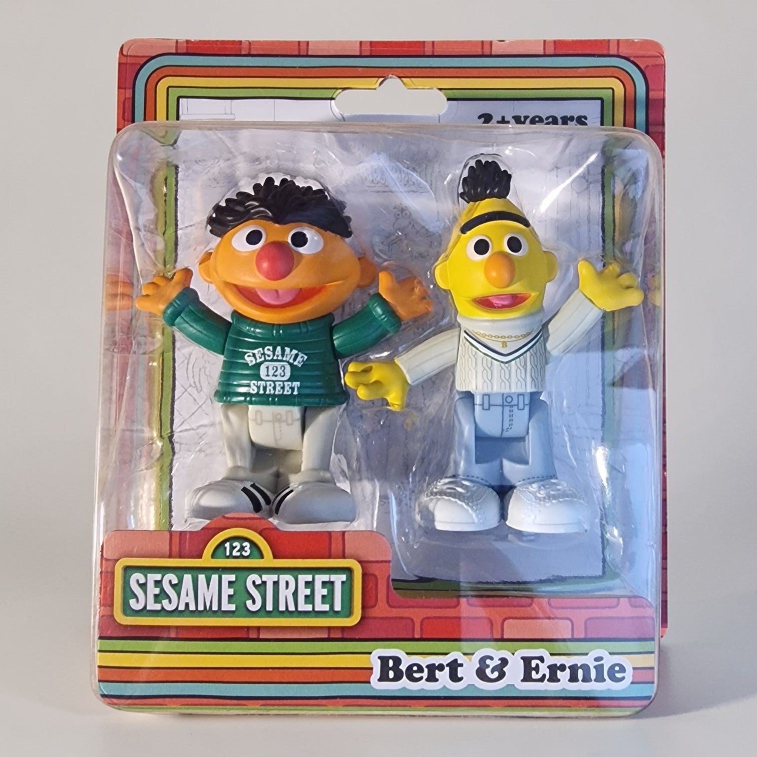 Packaged Sesame Street figures Bert and Ernie on a white background