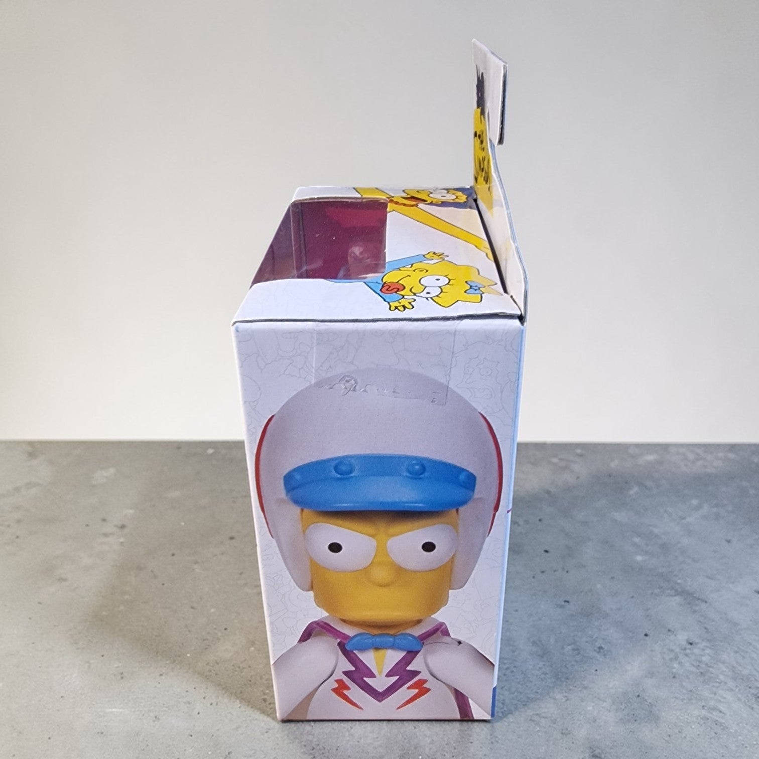 Cartoon character figure in a box with a clear front