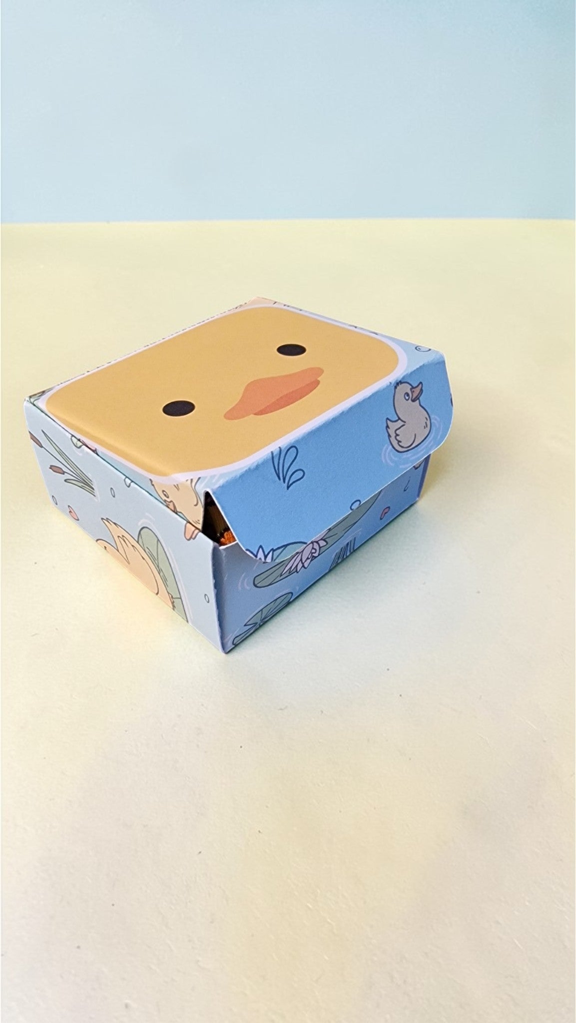 Cartoon character box with a light blue background
