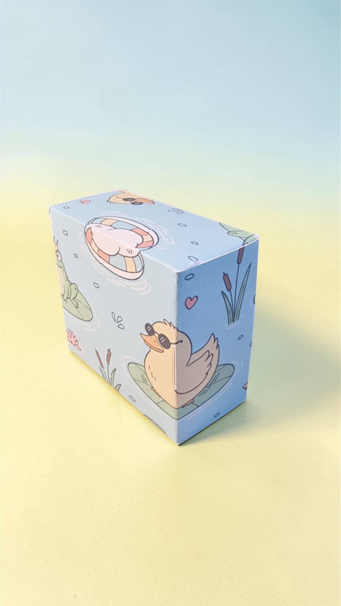 Cartoon-themed box with a duck design on a gradient background