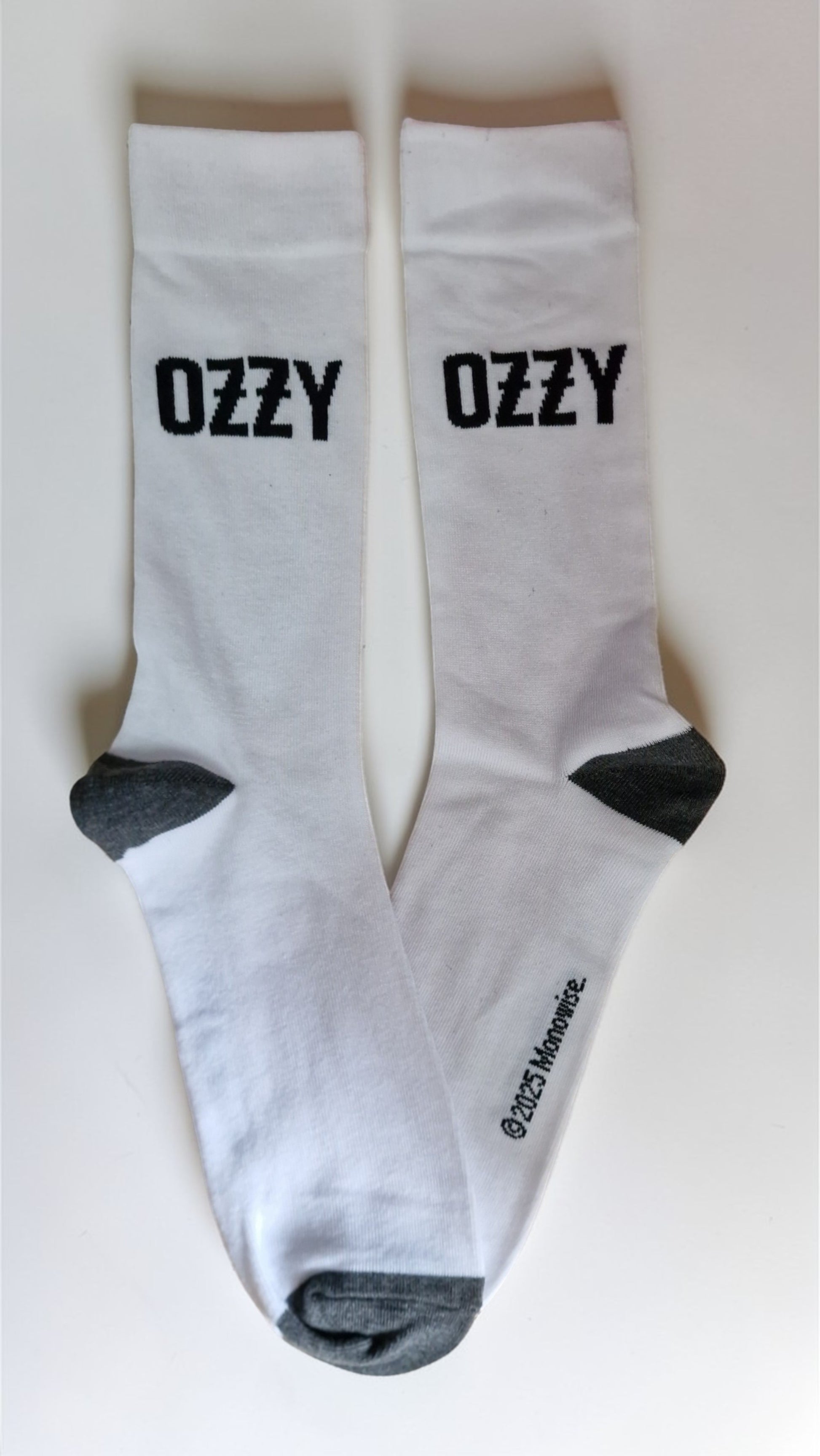 White socks with 'Ozzy' text on a white background