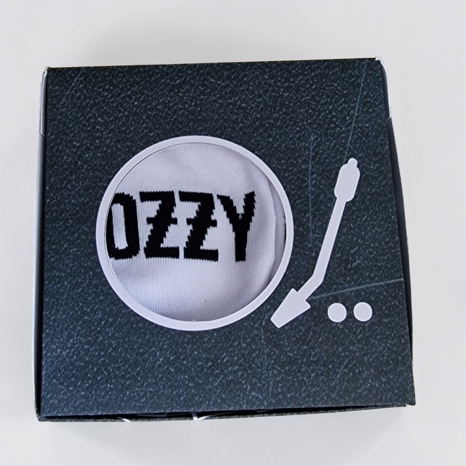 Box with 'Ozzy' design on a white background