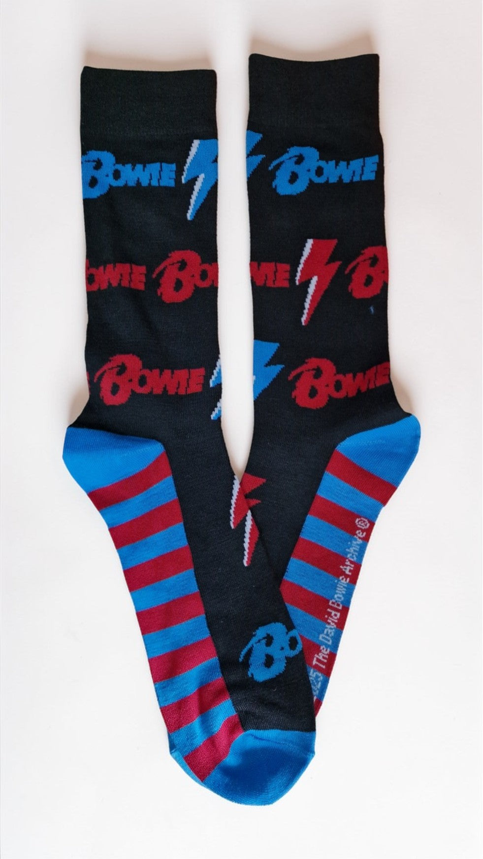 Black socks with blue and red patterns and 'Bowie' text on a white background