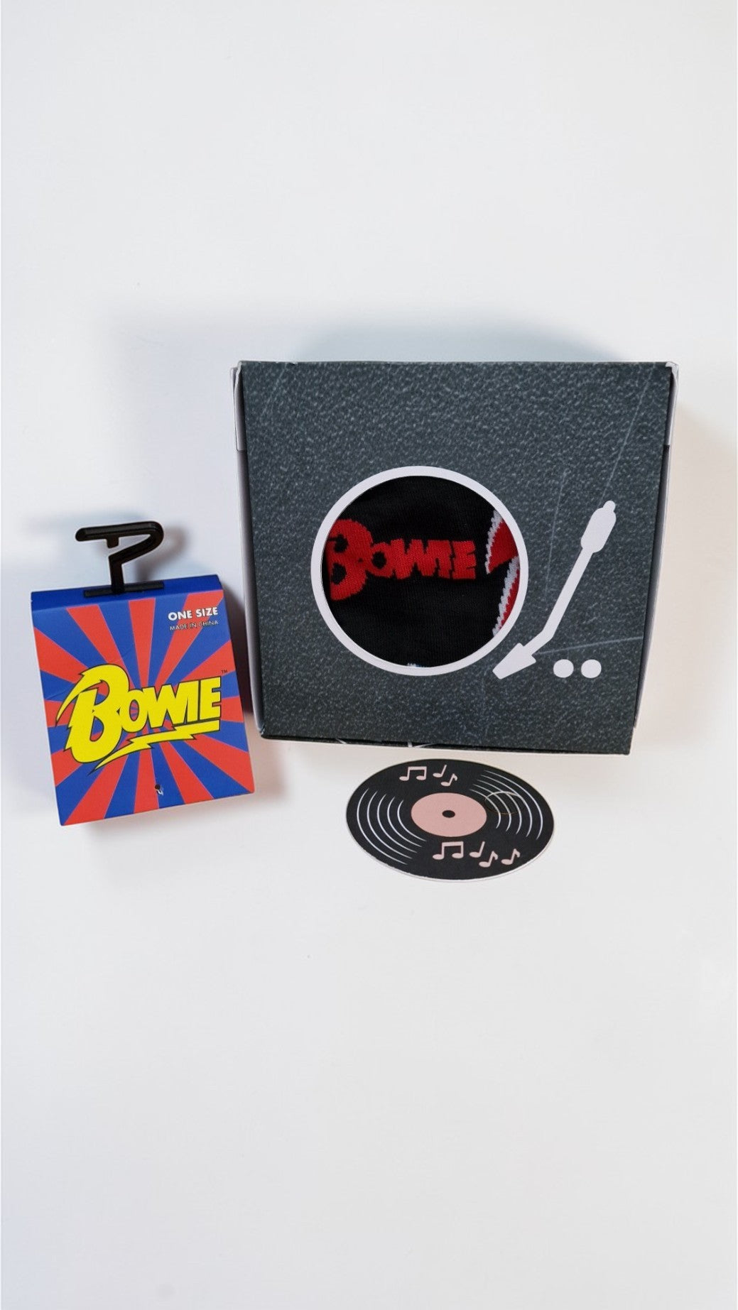 Packaging with 'Bowie' branding featuring a record and record player illustration on a white background