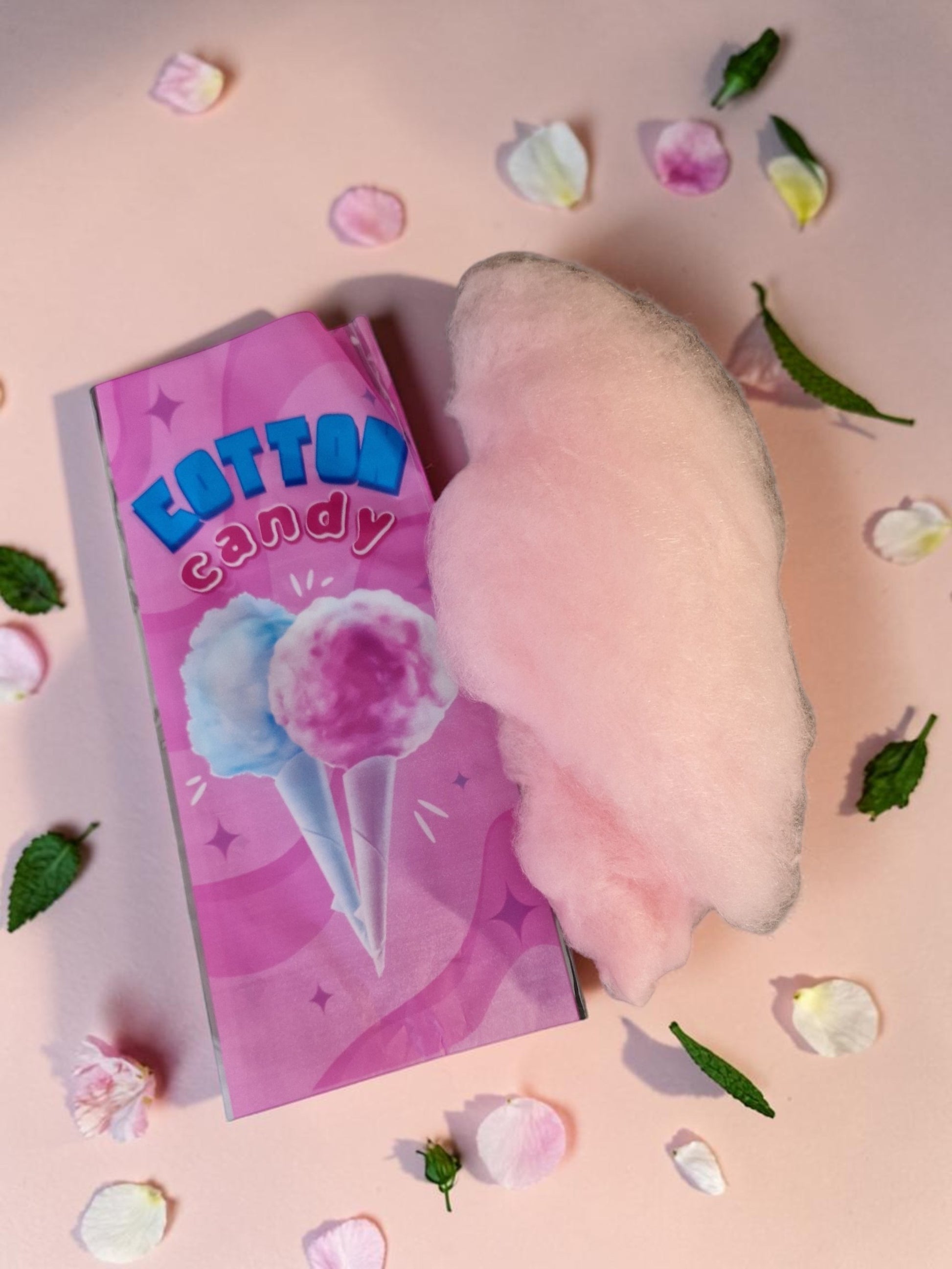 Cotton candy with a pink box labeled 'Cotton Candy' on a pink background with leaves and petals.