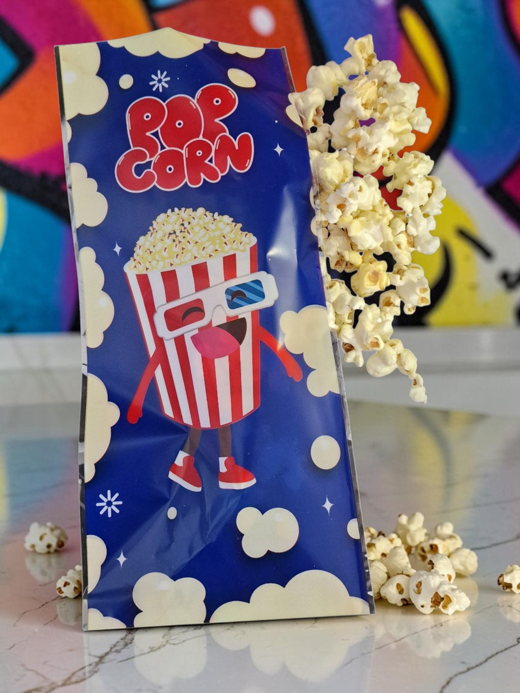 Popcorn bag with cartoon character and popcorn on a colorful background