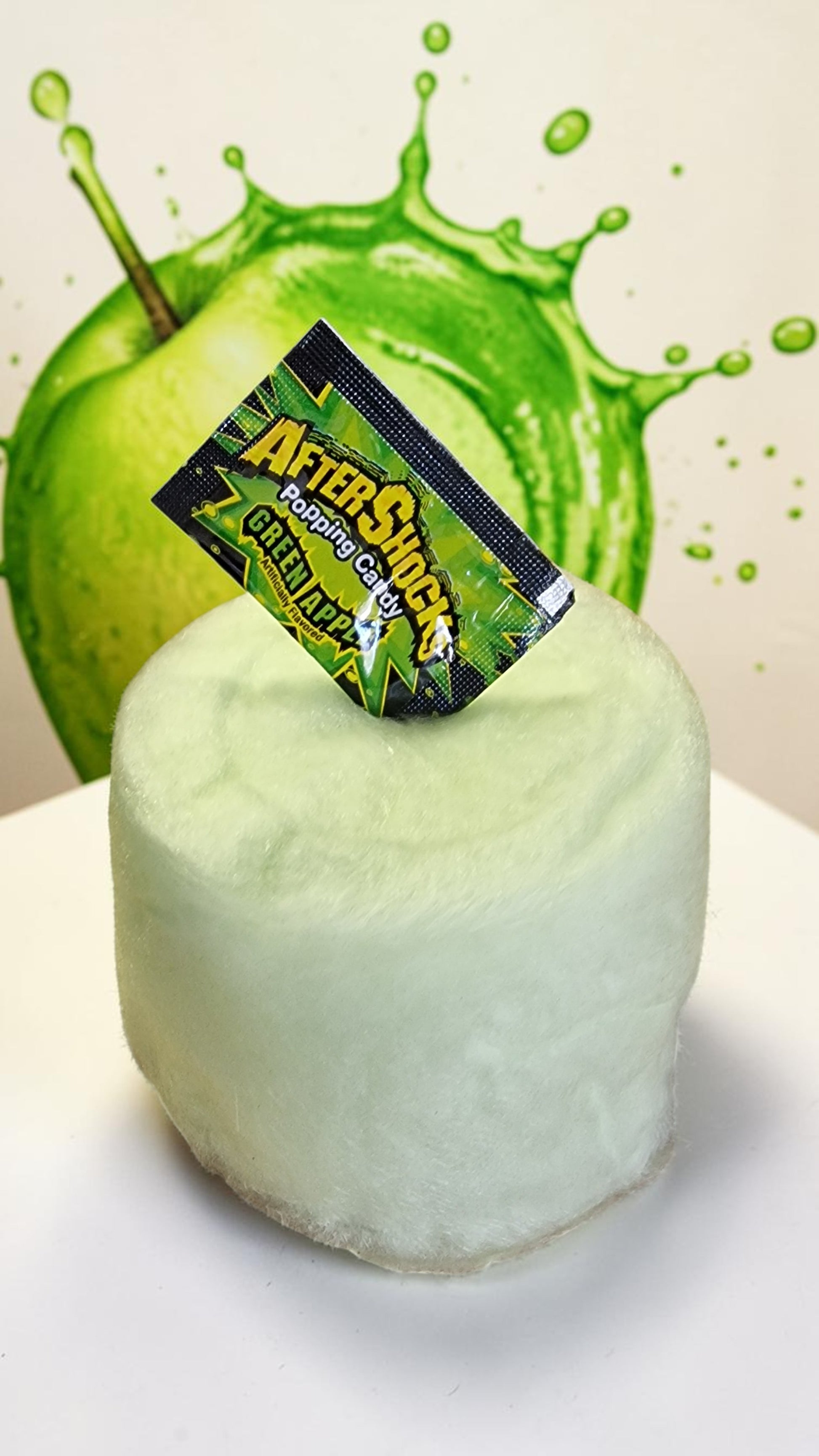 GreenAfterShokz product with a green apple and splash effect in the background