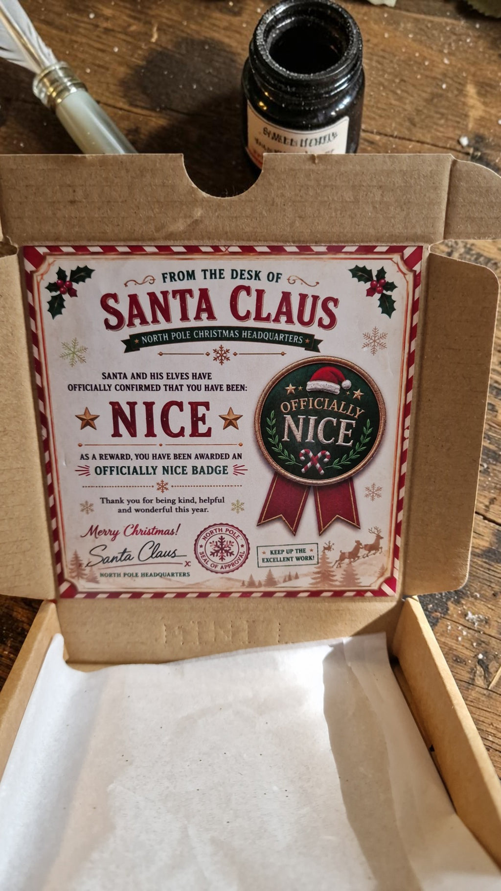 Cardboard box with a label from Santa Claus on a wooden surface