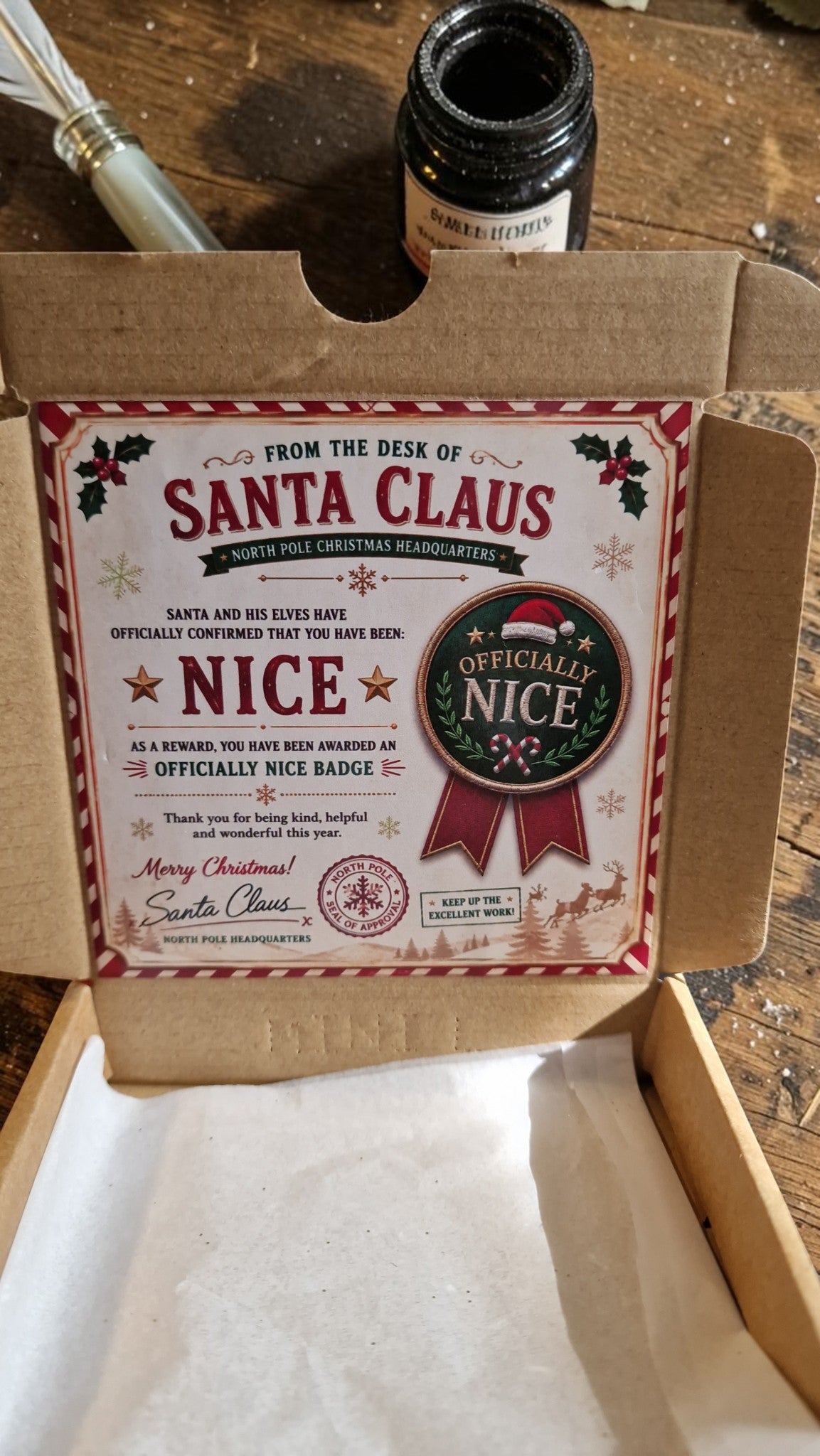 Cardboard box with a label from Santa Claus on a wooden surface
