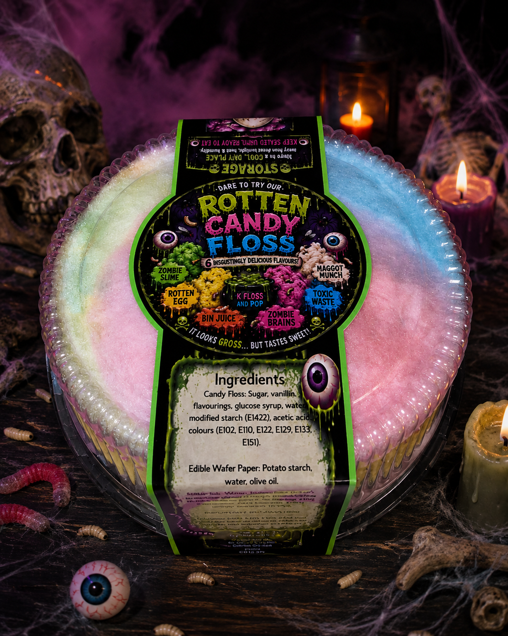 A round plastic tub of Rotten Candy Floss multicolor wax melts, wrapped in a green paper label, set against a dark, spooky Halloween background with candles, cobwebs, and a skull.