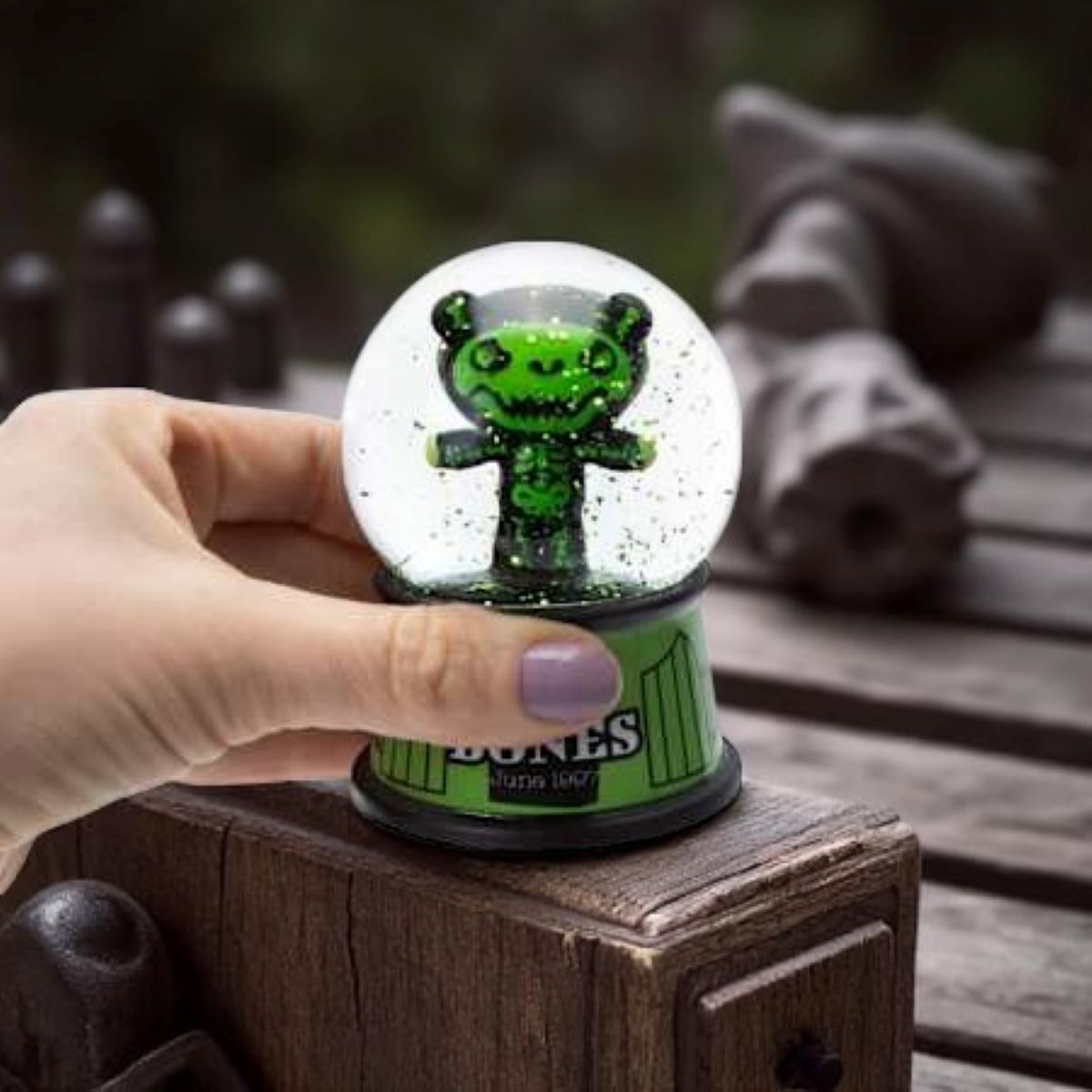 Deddy Bears Bones Mini Snow Globe with green skeleton bear inside, green and black base, collectible boxed figurine.