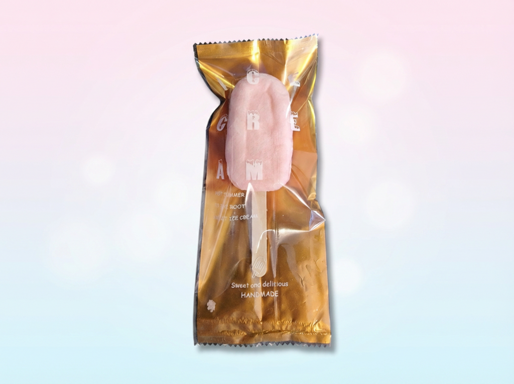 Pastry in a gold packaging on a gradient background