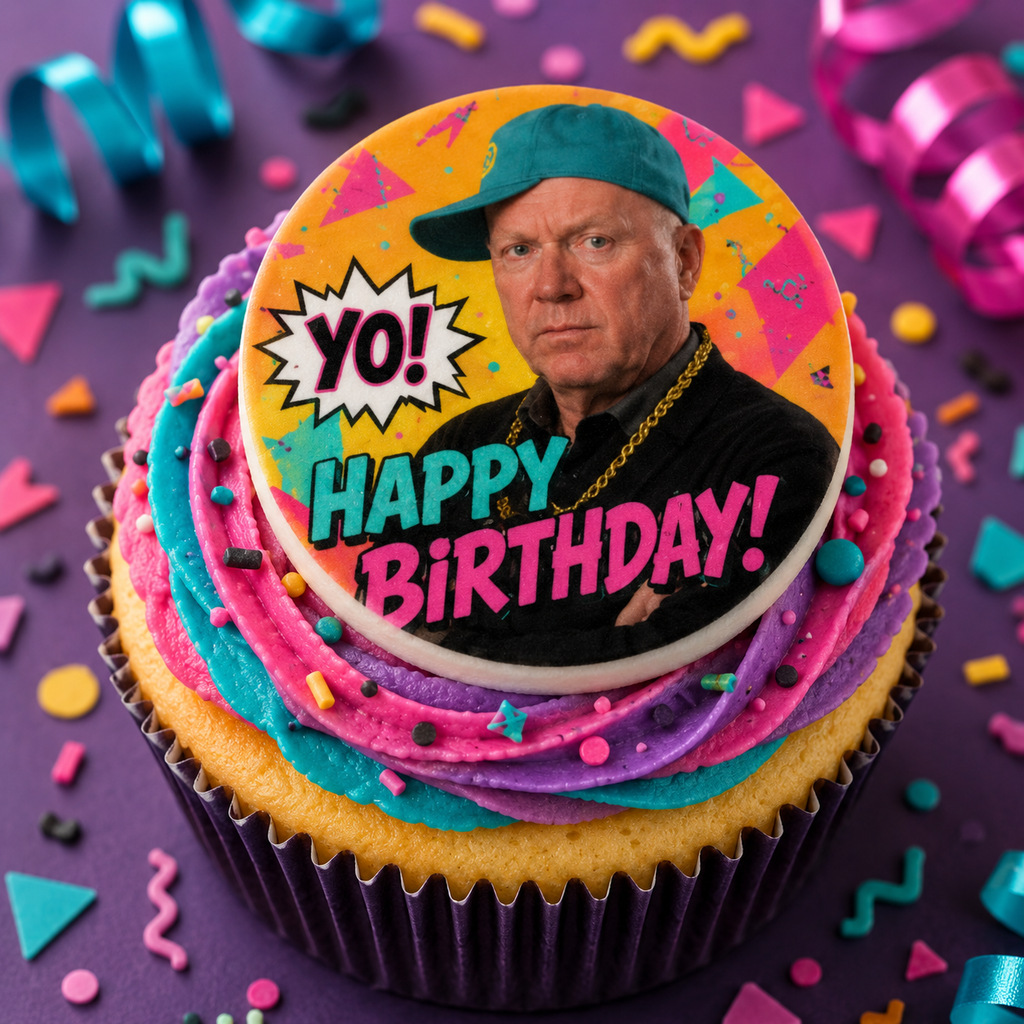 Colorful birthday cupcake with a decorative topper featuring a person and 'Happy Birthday' text on a purple background with party decorations.