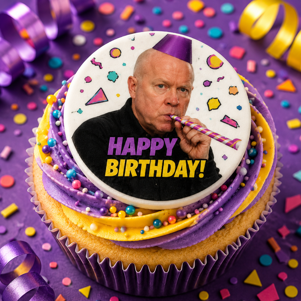 Cupcake with a birthday-themed topper featuring a person blowing a straw, surrounded by colorful decorations on a purple background.
