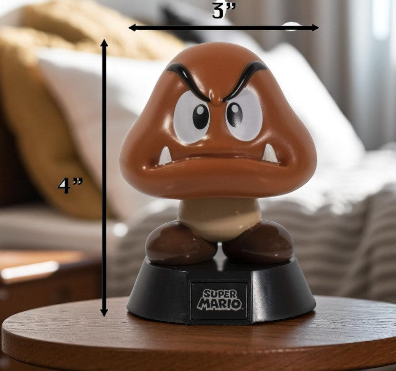 Paladone Icons Super Mario Goomba Light-Up Figure #002, 4-inch official Nintendo collectible, brown Goomba on black base, boxed.