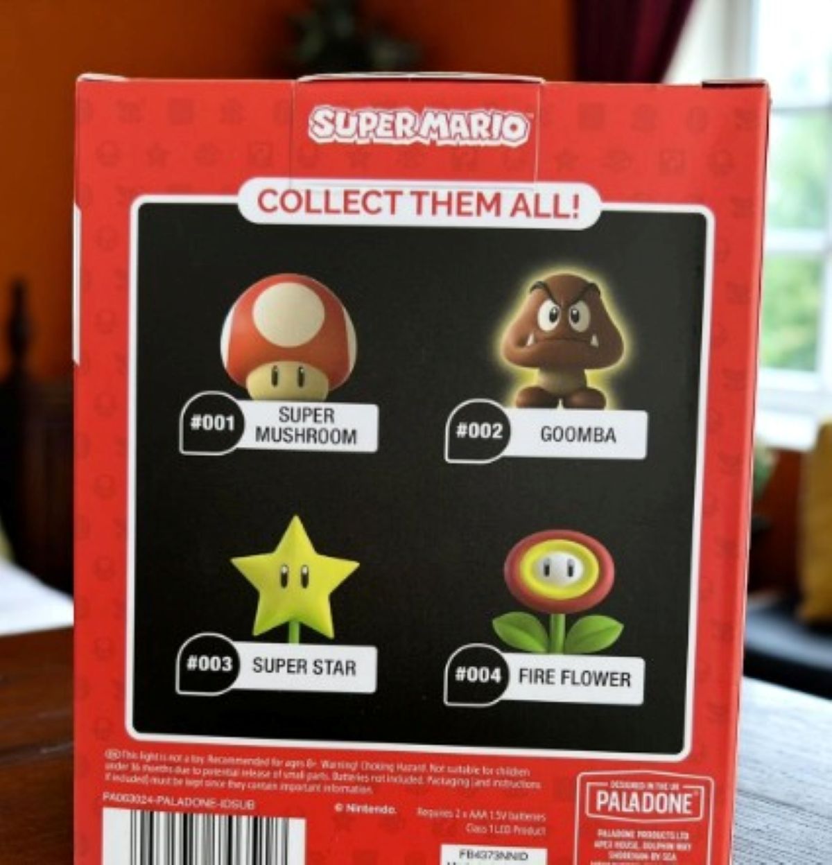 Paladone Icons Super Mario Goomba Light-Up Figure #002, 4-inch official Nintendo collectible, brown Goomba on black base, boxed.