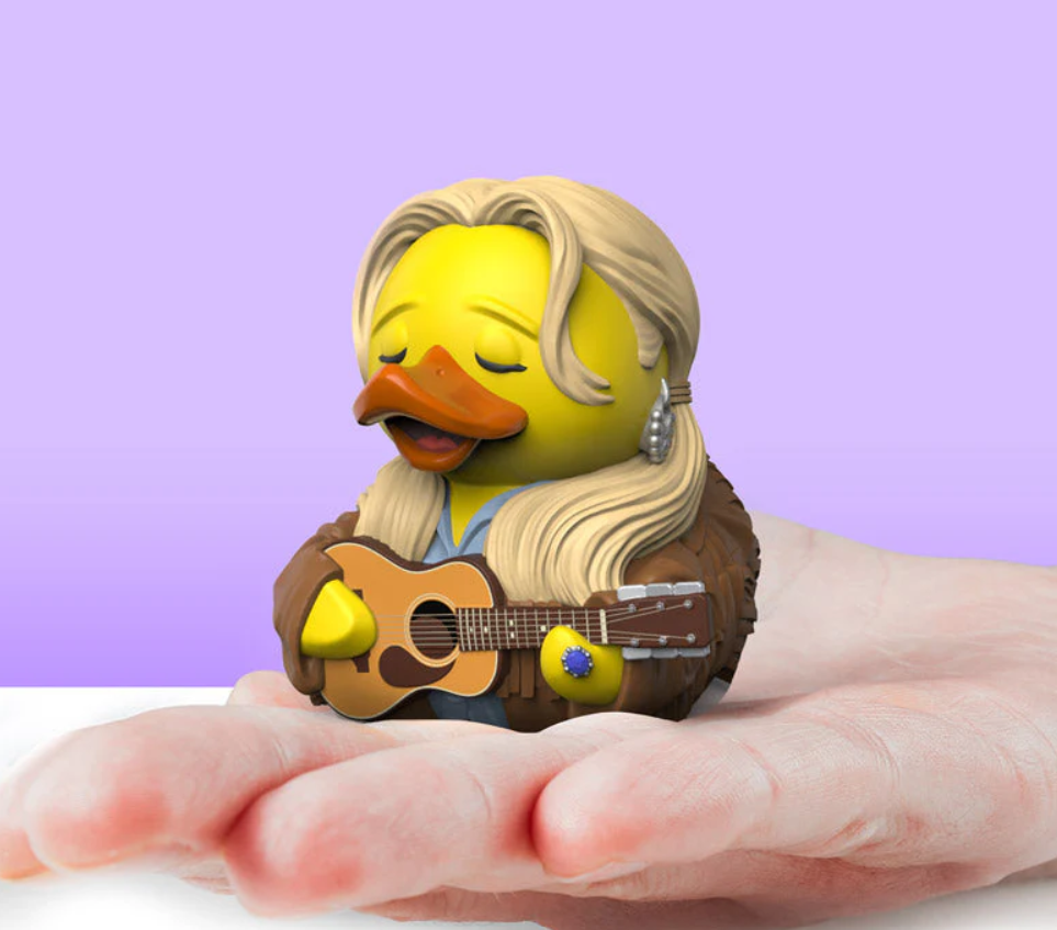 Rubber duck with blonde hair playing a guitar on a hand against a purple background