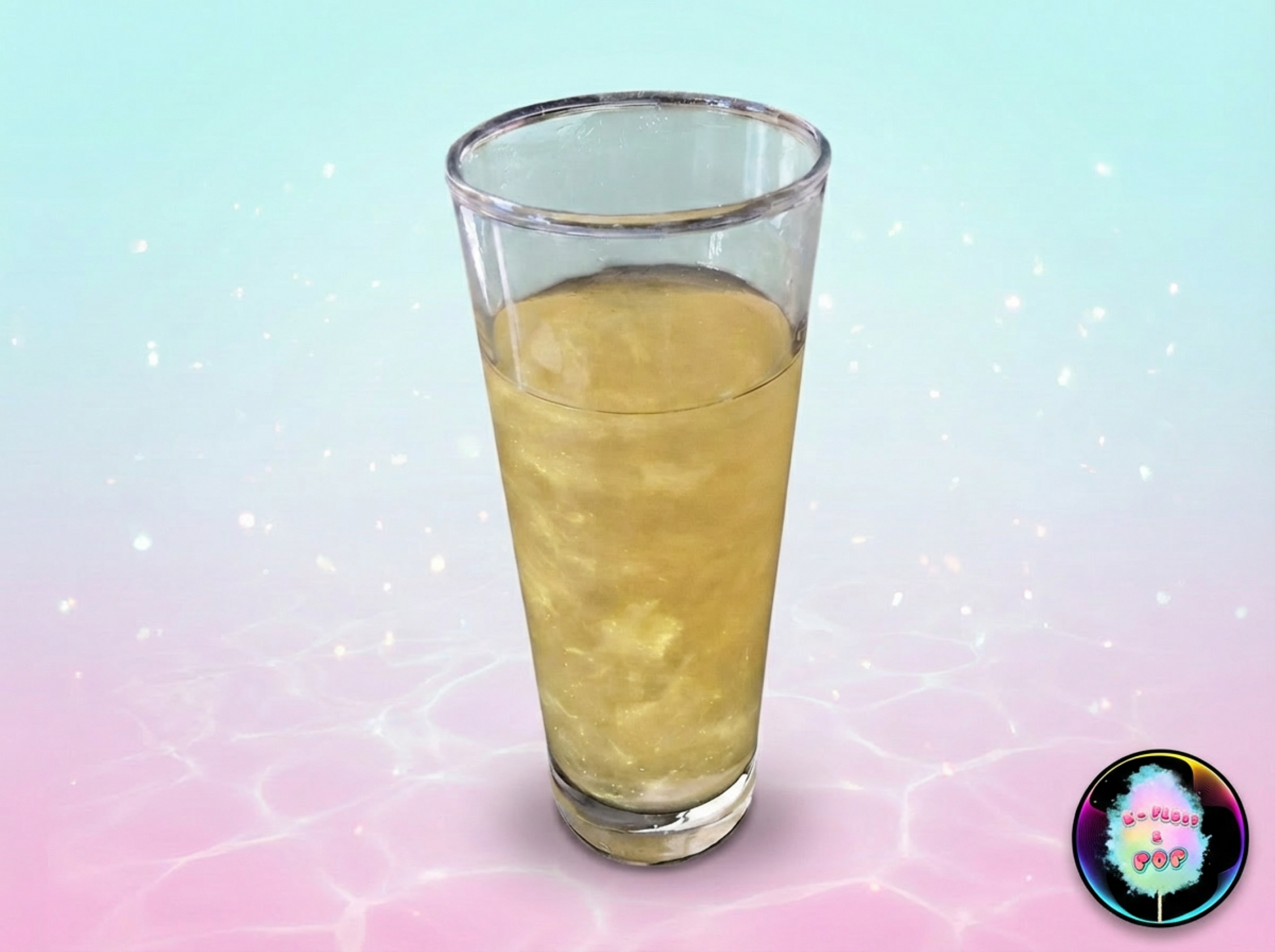 Clear glass filled with a yellowish liquid on a gradient background
