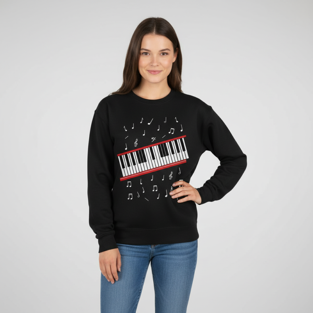 Woman wearing a black sweatshirt with a piano design on a gray background