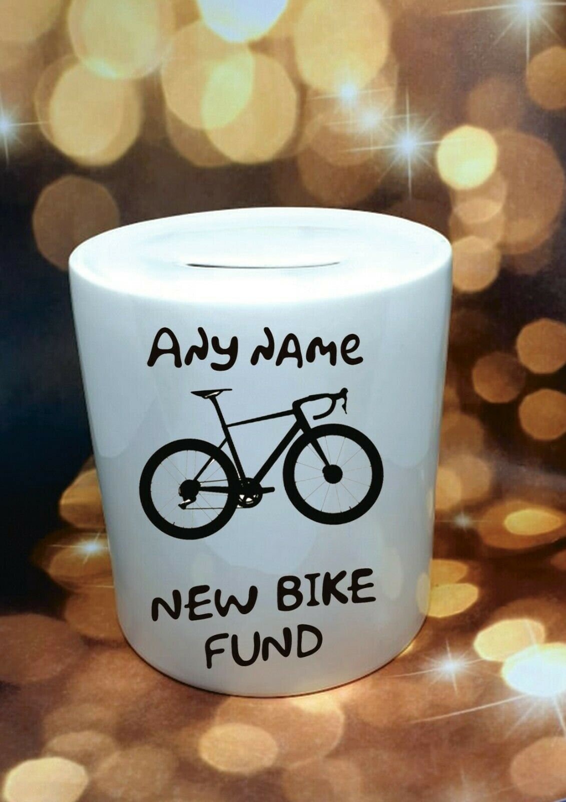 Personalised ceramic cycling money box for bike or ebike fund, with removable plug and custom text, displayed as a gift for cyclists.