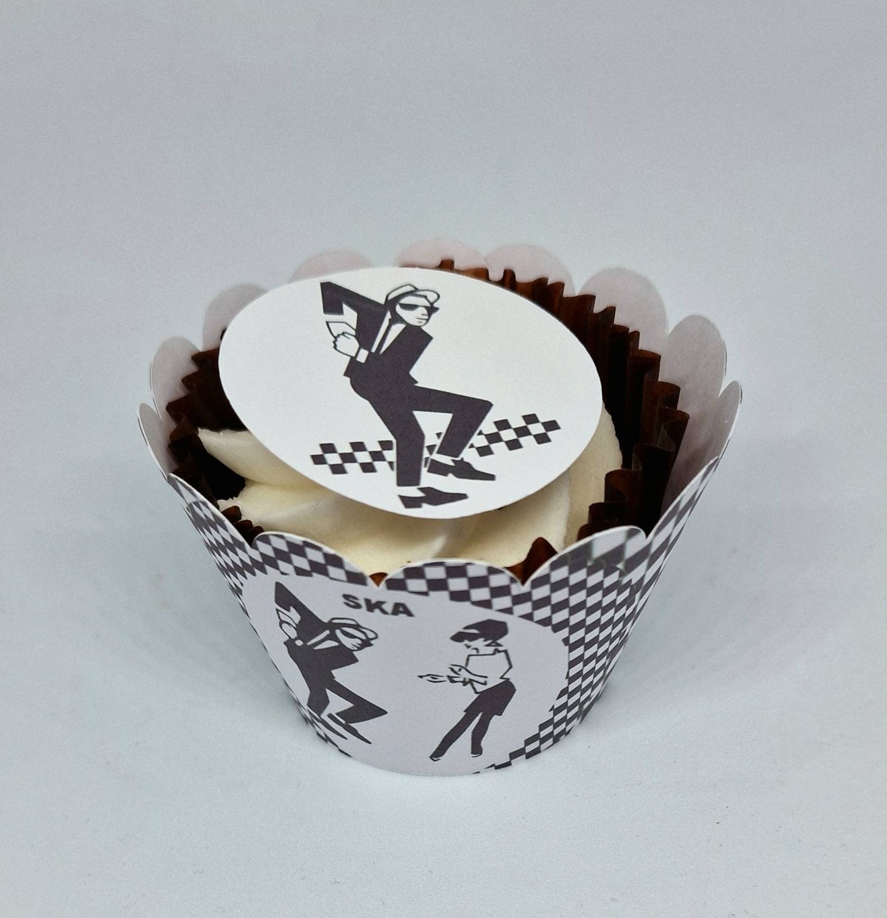 Set of 15 round and shaped edible cake toppers featuring ska hats, rude boys, checkerboards, Northern Soul fist, and 2 Tone logos, displayed on a wooden table.