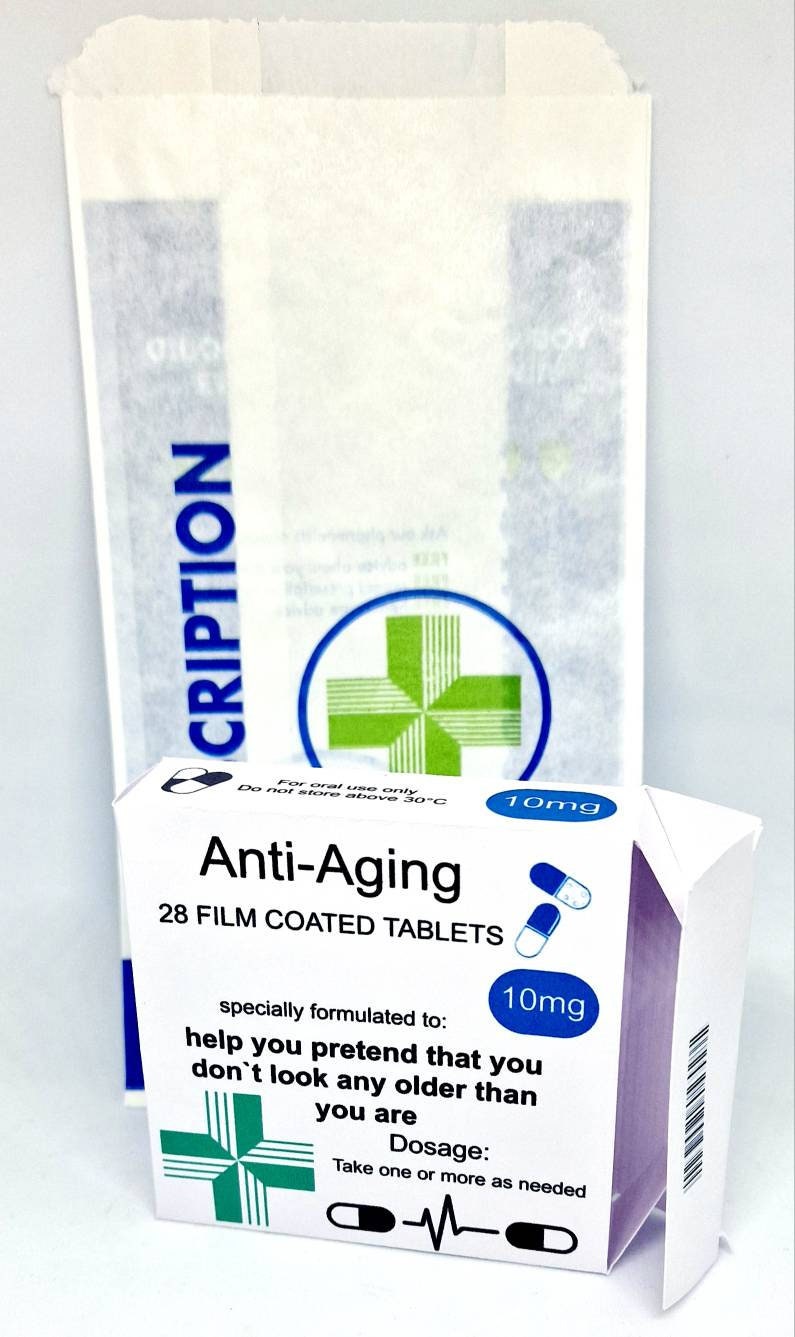 Funny prank pill box labelled “Anti Aging Tablets” and “Anti Moaning Pills” – novelty retirement or milestone birthday gift
