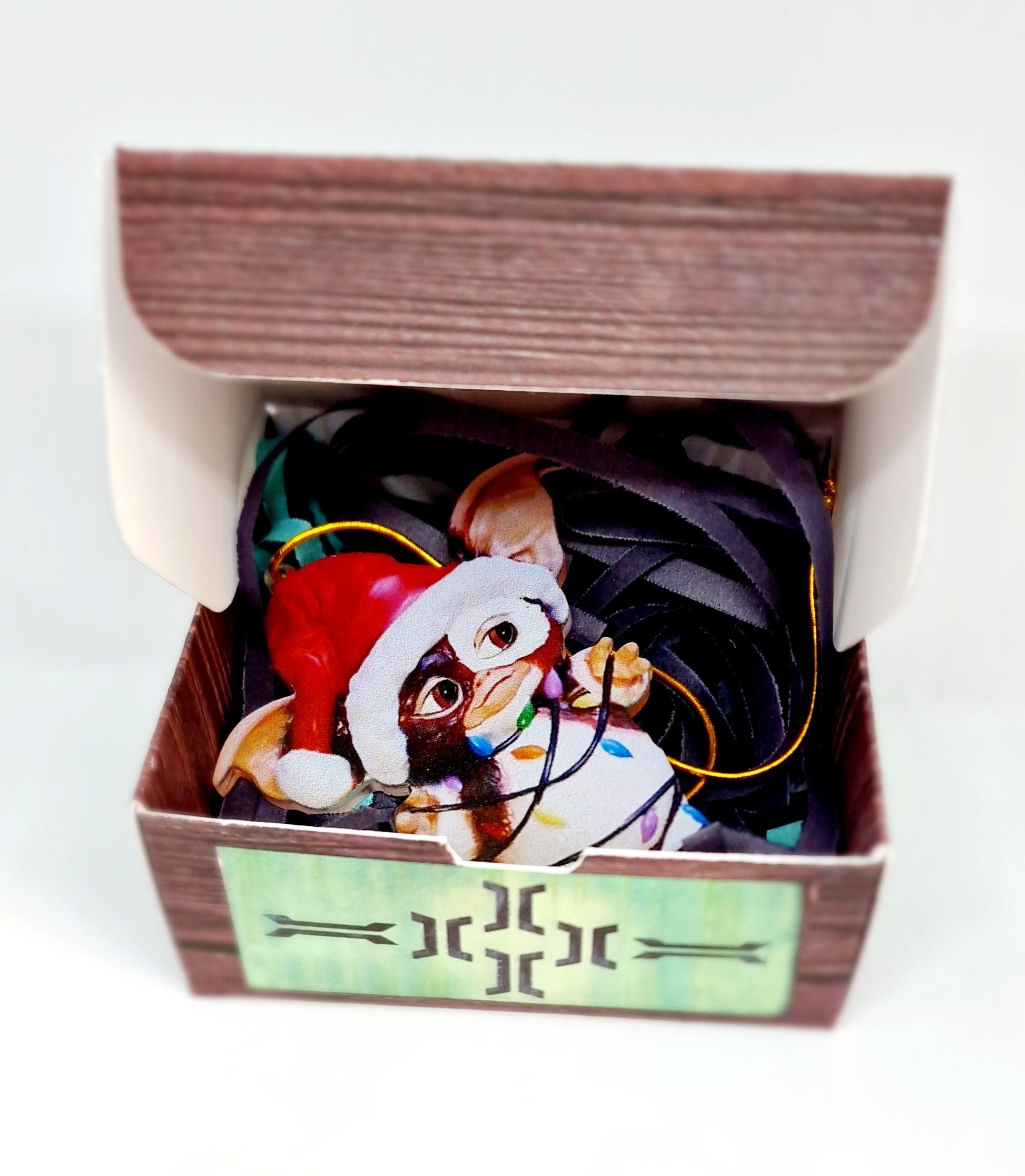 Handmade acrylic Gizmo Mogwai ornament with gift box, rule card, and free badge, displayed as a Christmas or Secret Santa gift.