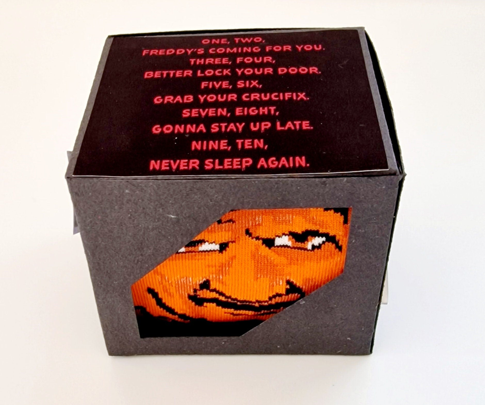 Freddy Krueger socks in Nightmare on Elm Street themed gift box, perfect novelty Halloween gift or Secret Santa present.