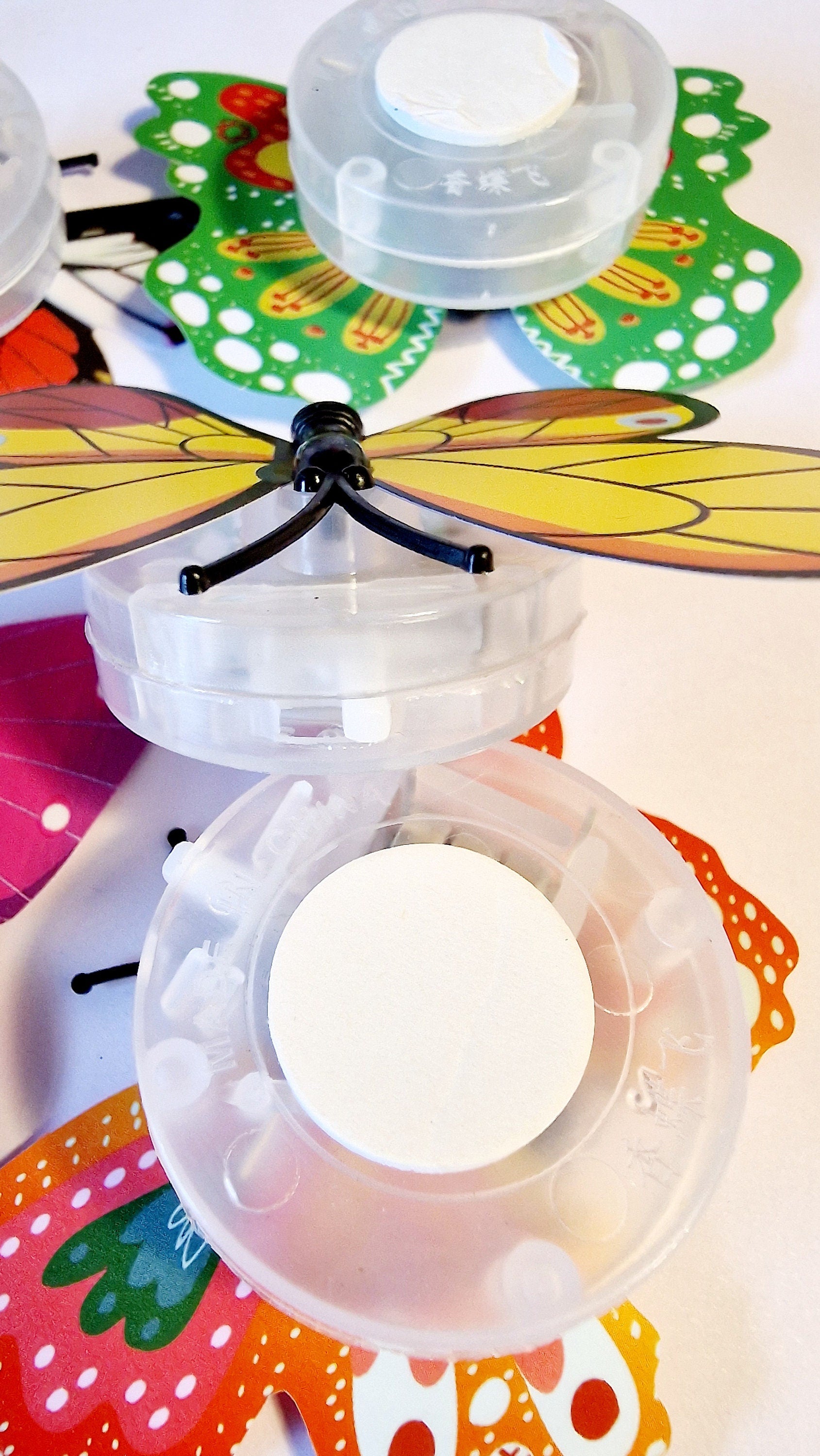 Set of five colourful butterfly LED night lights flashing on a wall, shown as fun party and room decor.