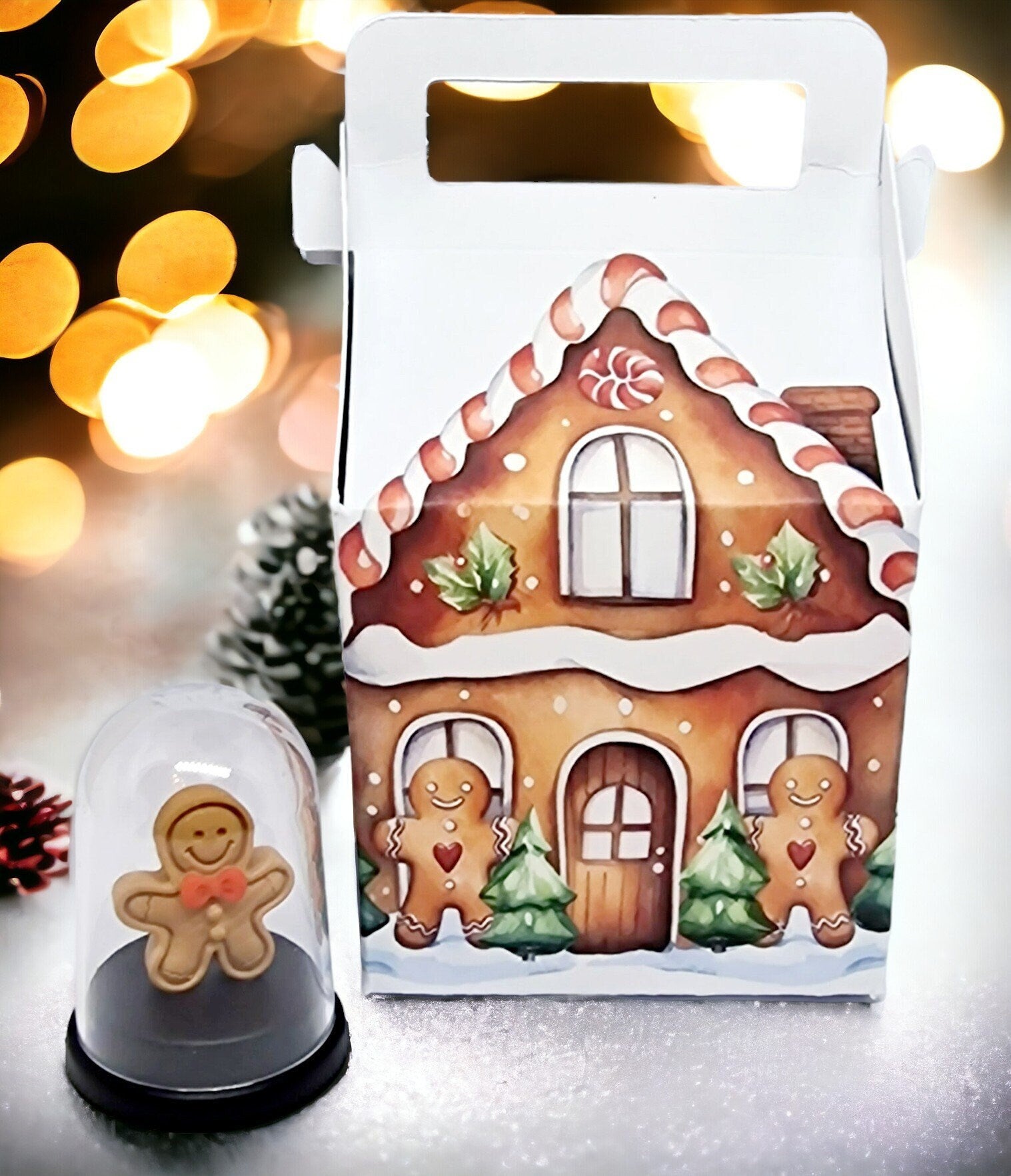 Miniature 5cm pet gingerbread man inside a small gingerbread house, displayed as a fun gift for Secret Santa or birthdays.