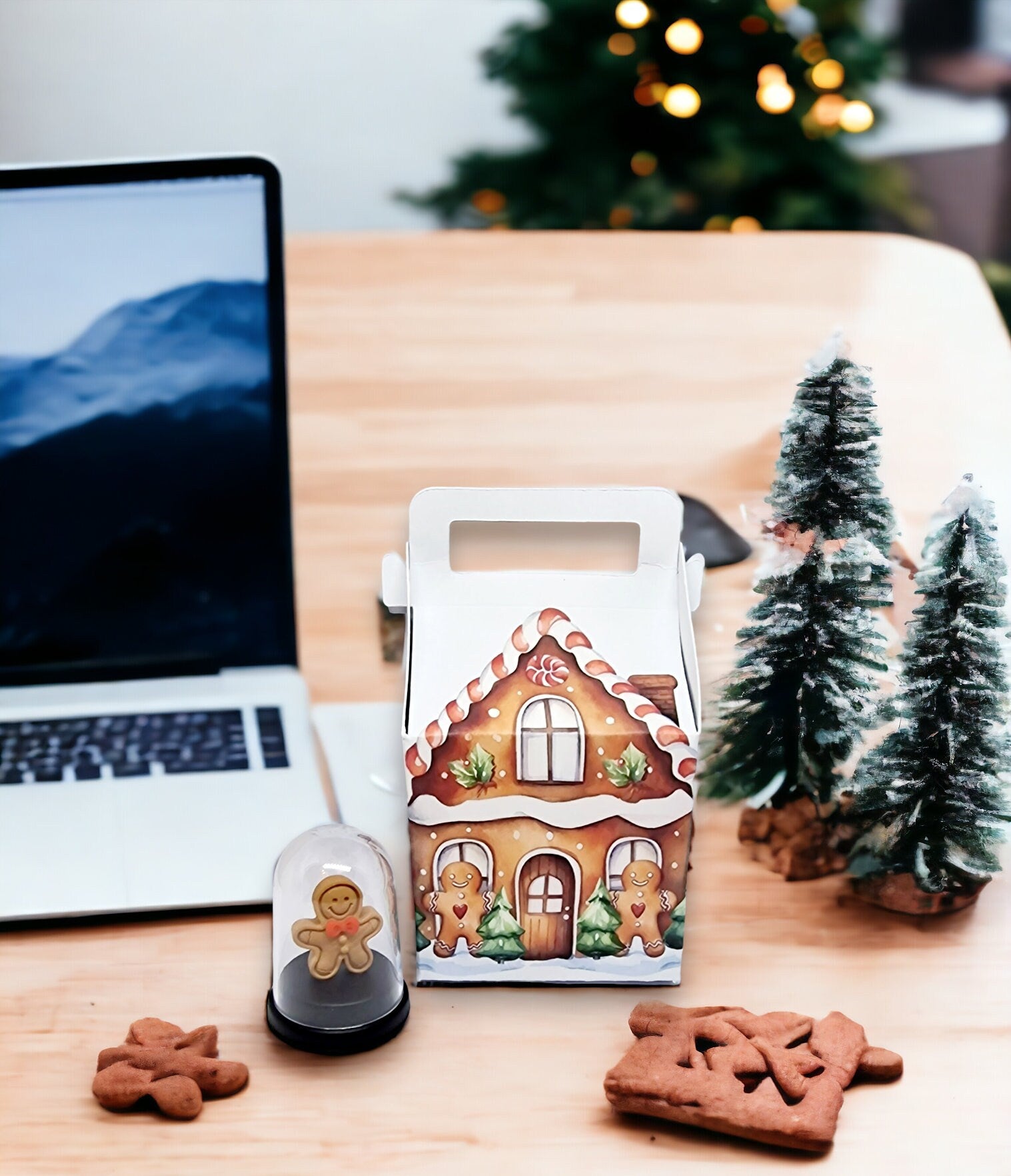 Miniature 5cm pet gingerbread man inside a small gingerbread house, displayed as a fun gift for Secret Santa or birthdays.