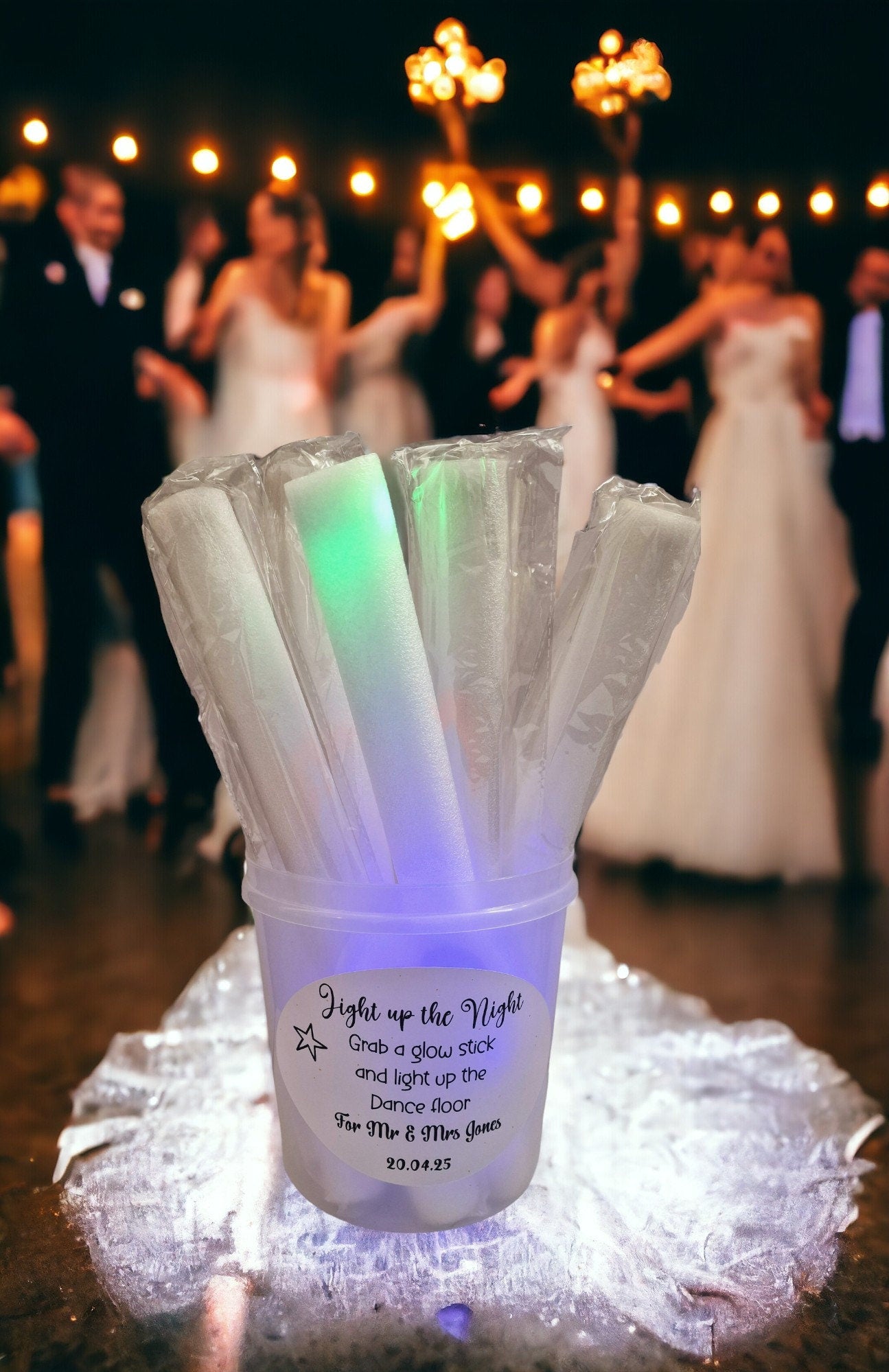 Personalised clear tub containing 10 colourful LED foam glow sticks, ideal for parties, weddings, and children’s celebrations.