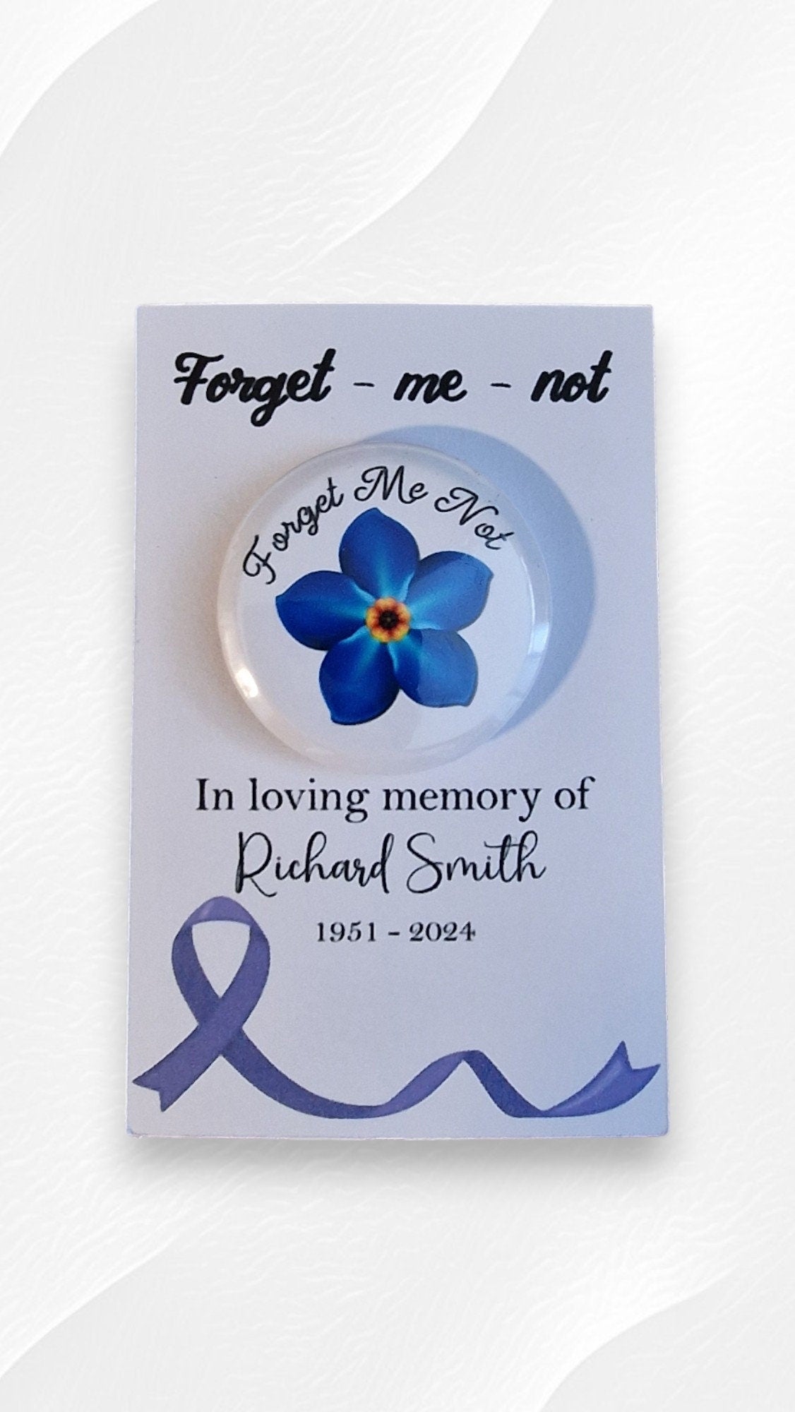 Set of 20 forget me not funeral badges on personalised “In Loving Memory” cards, displayed as keepsake mementos for funerals or dementia remembrance.