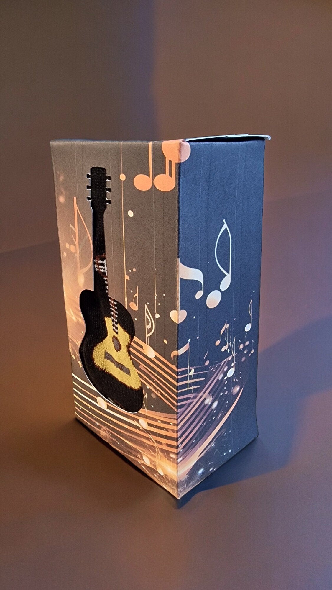 Guitar-themed socks displayed in a guitar-shaped gift box – perfect novelty music gift for adults, Secret Santa, or musicians