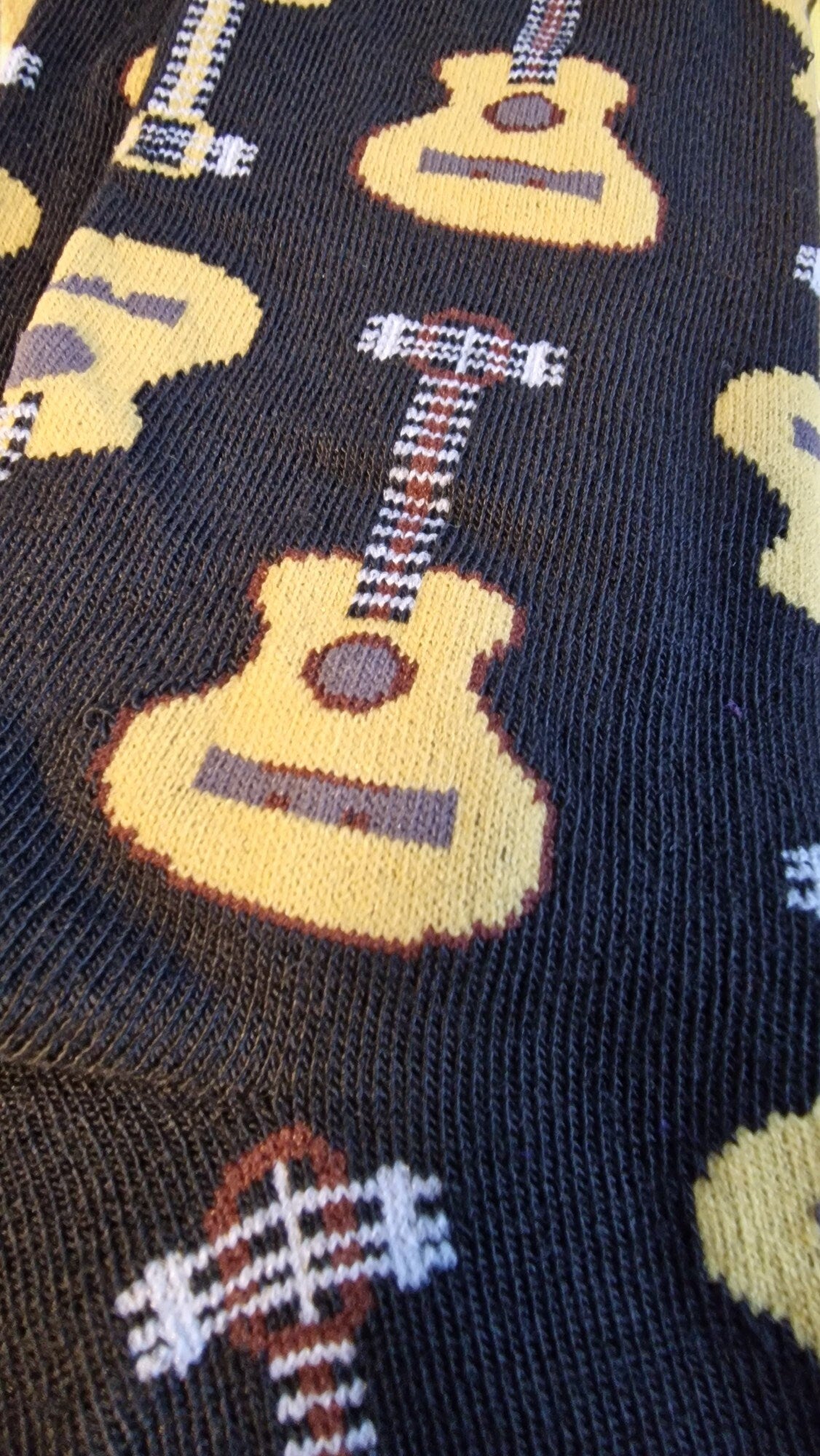 Guitar-themed socks displayed in a guitar-shaped gift box – perfect novelty music gift for adults, Secret Santa, or musicians