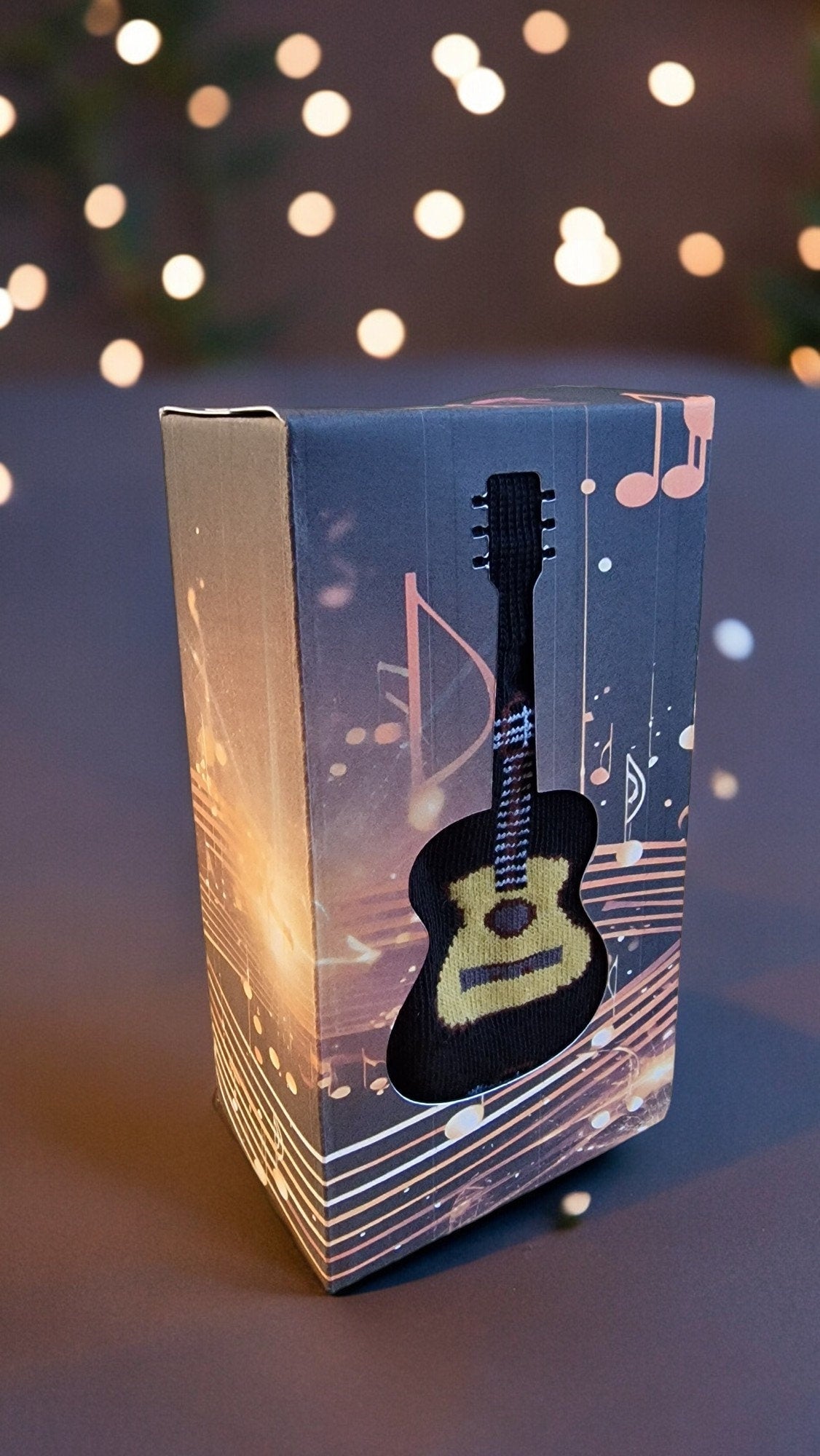 Guitar-themed socks displayed in a guitar-shaped gift box – perfect novelty music gift for adults, Secret Santa, or musicians