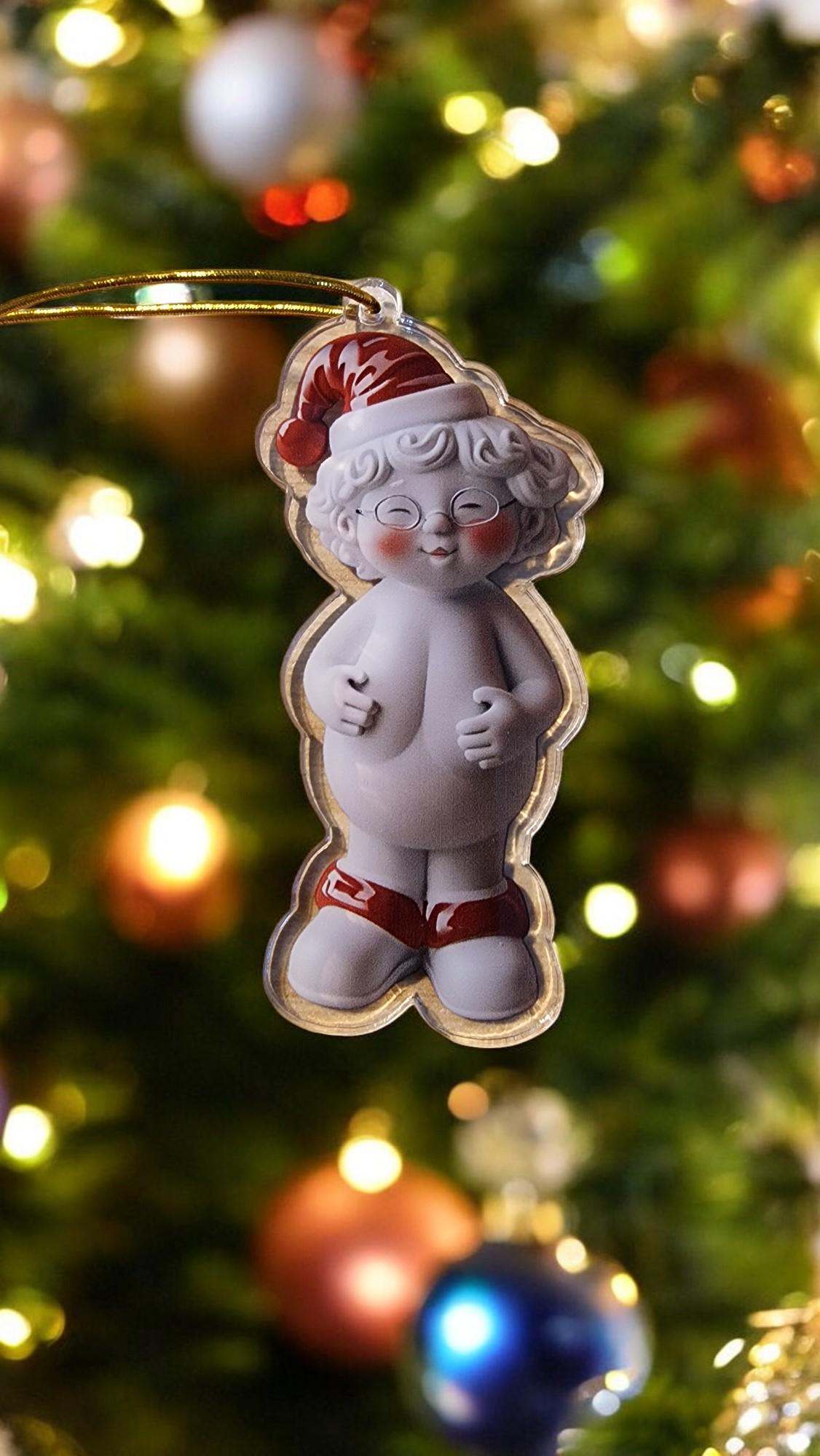Acrylic Naked Santa and Mrs Claus funny Christmas tree ornaments in a gift box, displayed as cheeky festive decorations.