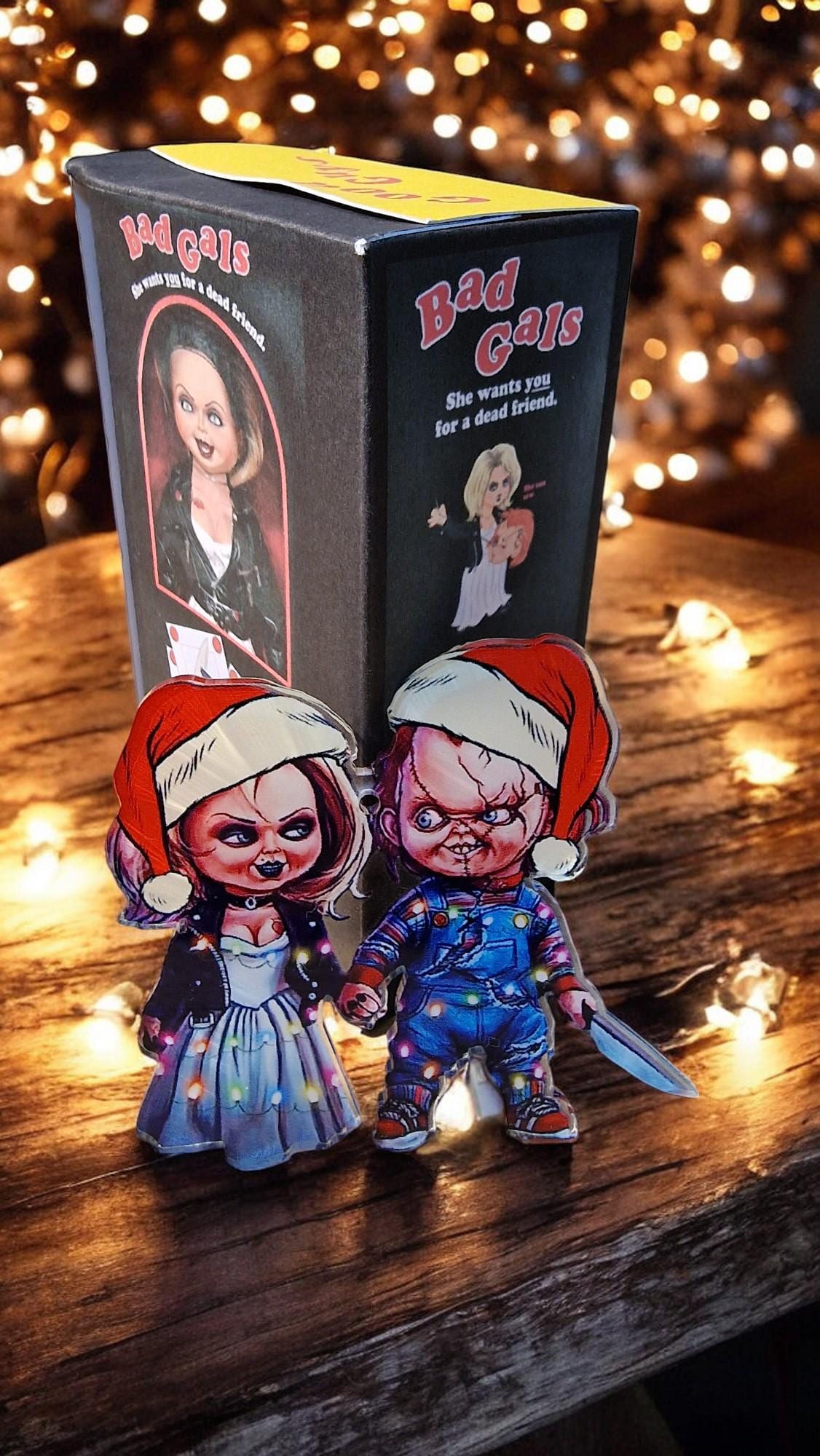 Acrylic Chucky and Bride of Chucky Tiffany Christmas tree decorations in a themed gift box, displayed as horror movie ornaments.